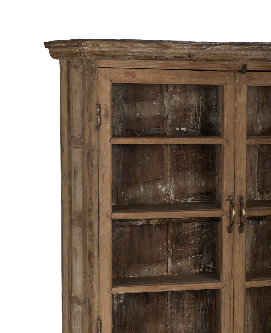 Vintage bleached oak cabinet from India, showing intricate glass details and rustic brass pull handles.