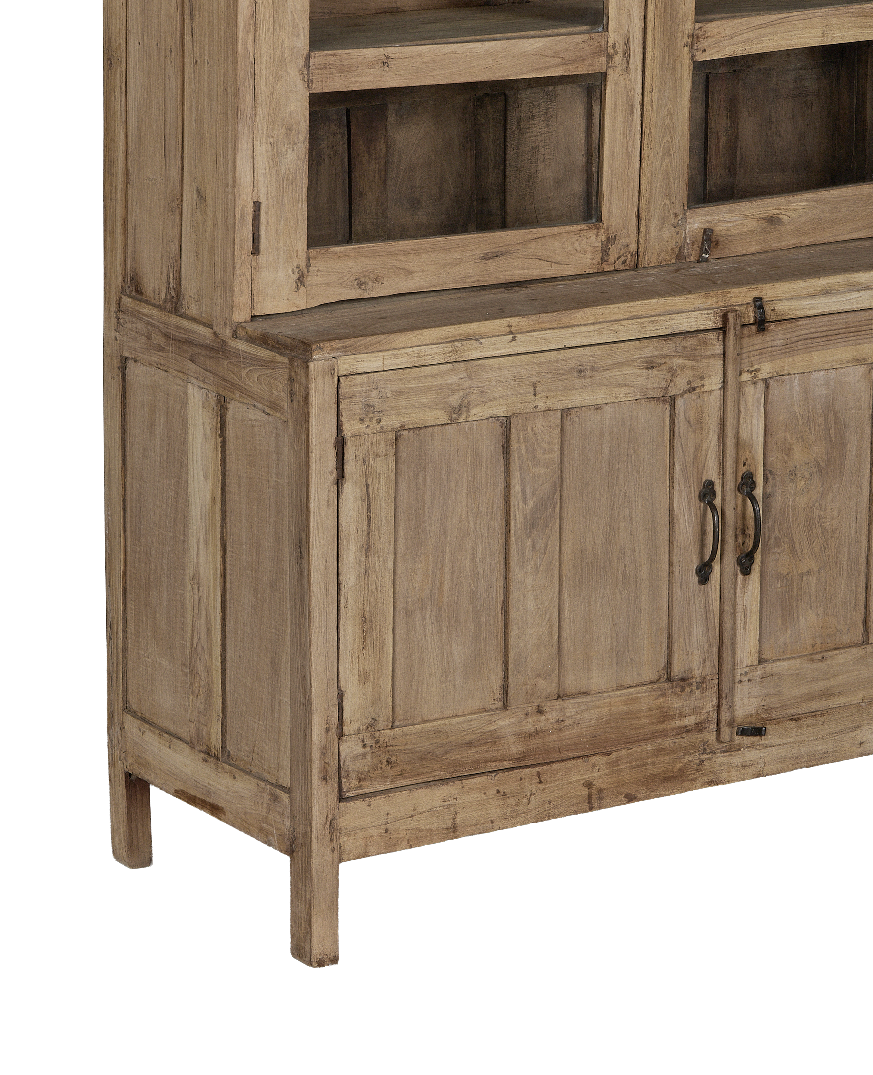 Corner view of vintage bleached oak cabinet from India, showing rustic panels and dark metal pulls.