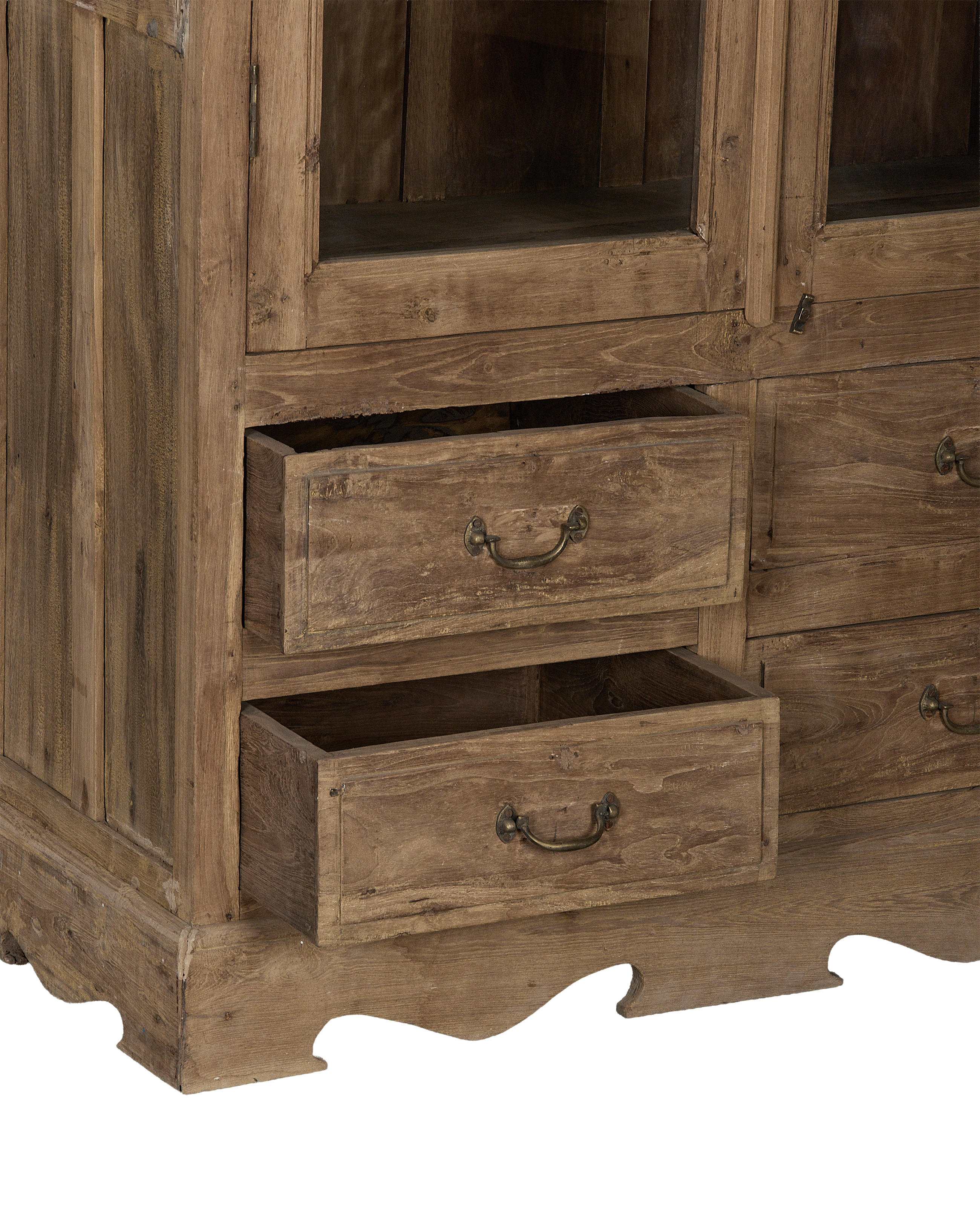 Vintage bleached oak cabinet base, close-up of open drawers and ornate bottom trim.