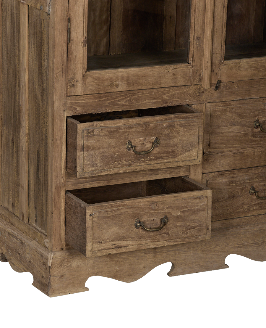 Vintage bleached oak cabinet base, close-up of open drawers and ornate bottom trim.