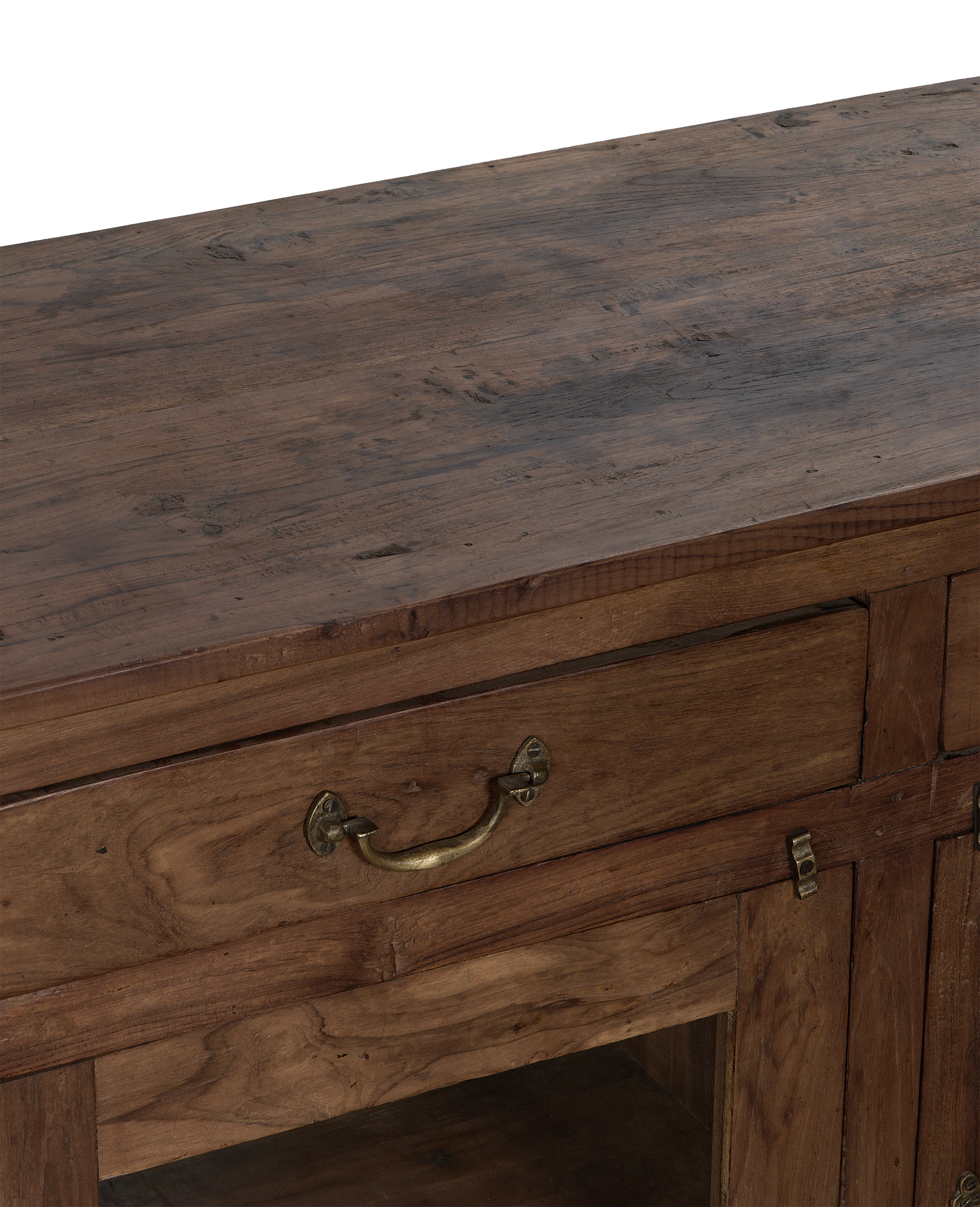 Vintage Indian dark oak sideboard's detailed top and drawer with brass pull handle.