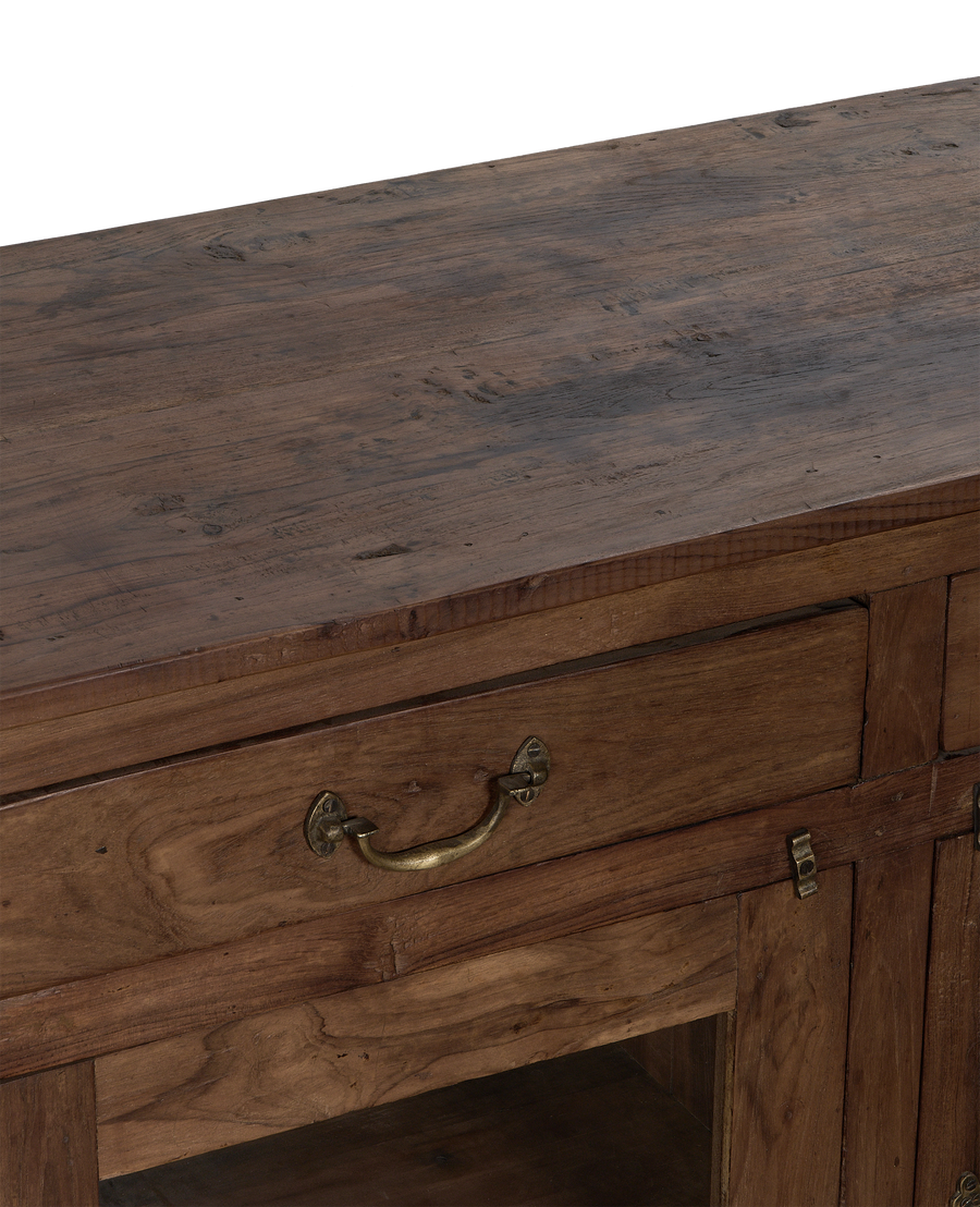 Vintage Indian dark oak sideboard's detailed top and drawer with brass pull handle.