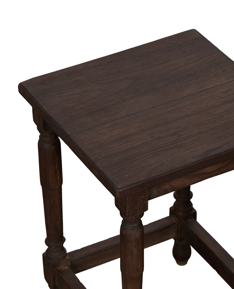 Vintage oak side table, detailed view of rich stained wood grain with turned legs.