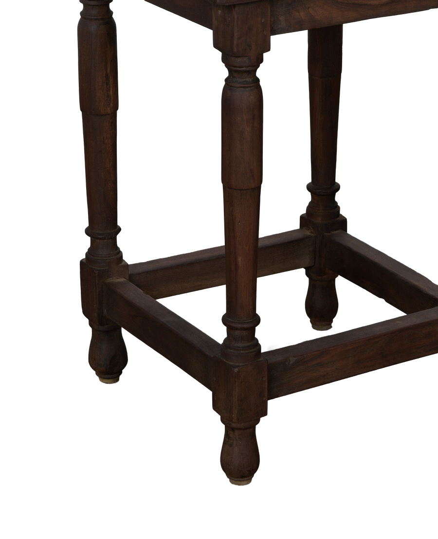 Vintage Indian oak side table showing lower frame with turned legs and foot detail.