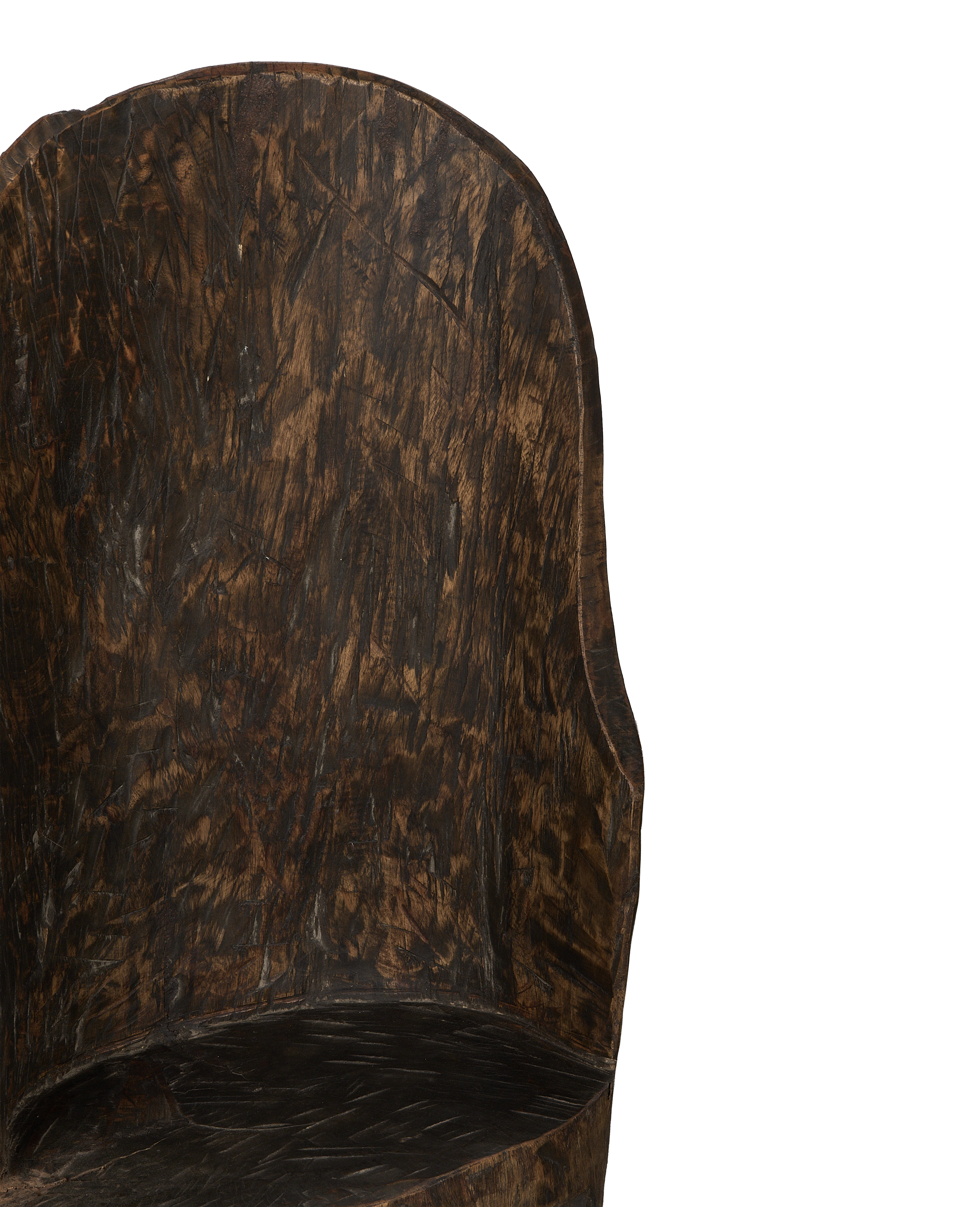 Close-up of vintage Nagaland oak chair's aged wood backrest texture.