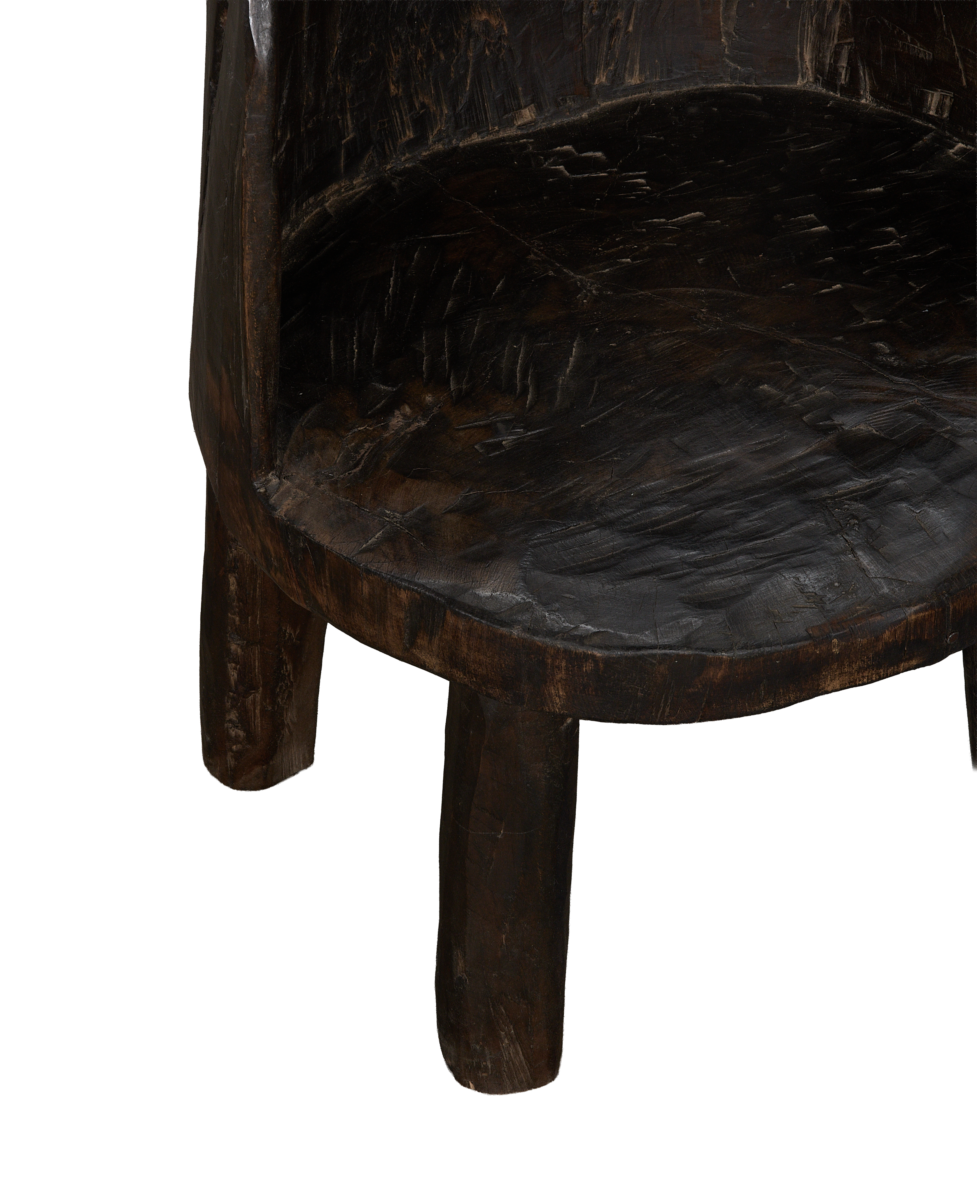 Vintage Nagaland oak chair detail, showing textured aged dark wood seat and sturdy base.