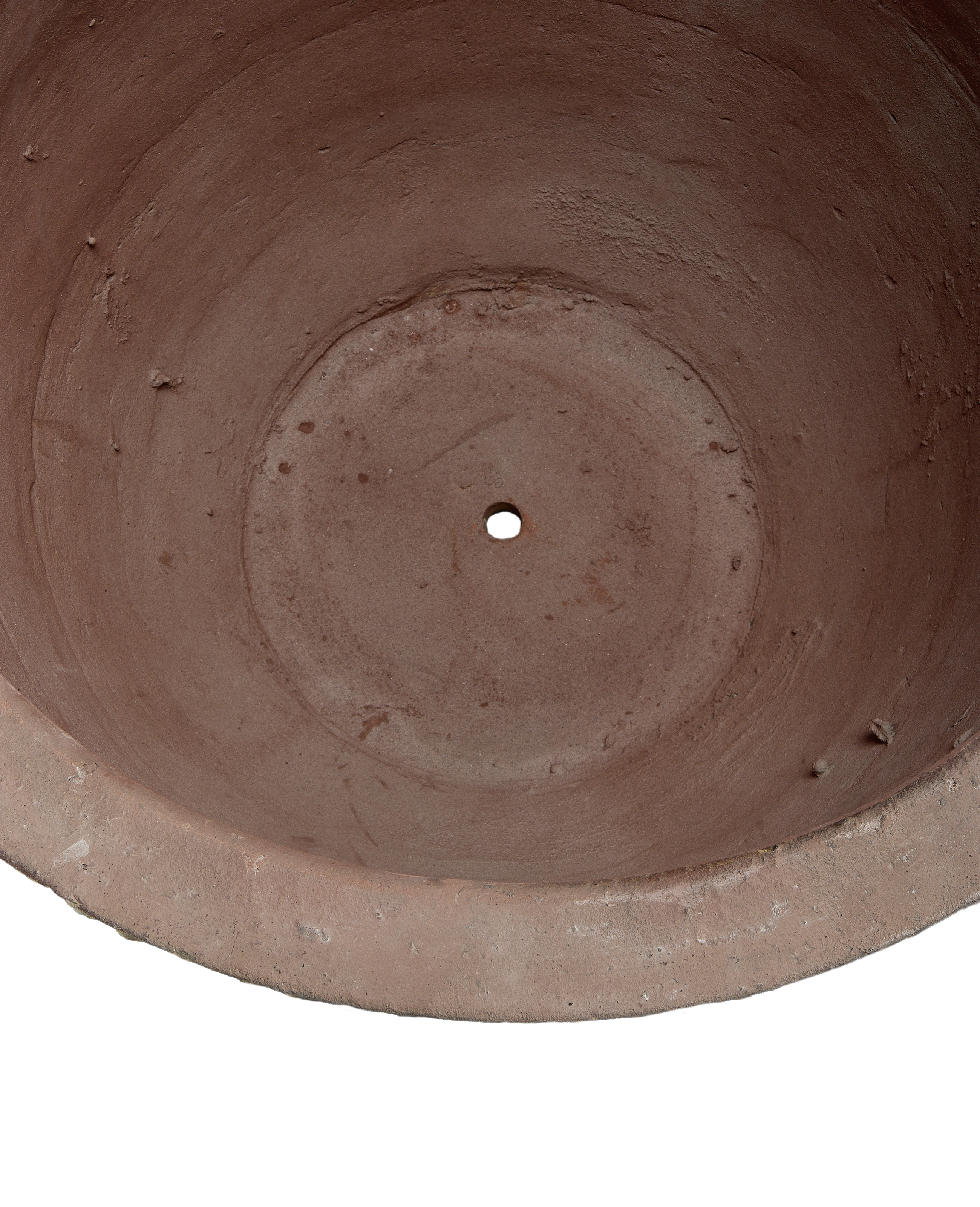 Terracotta planter's interior, showing drainage hole and weathered texture of the vintage pot.