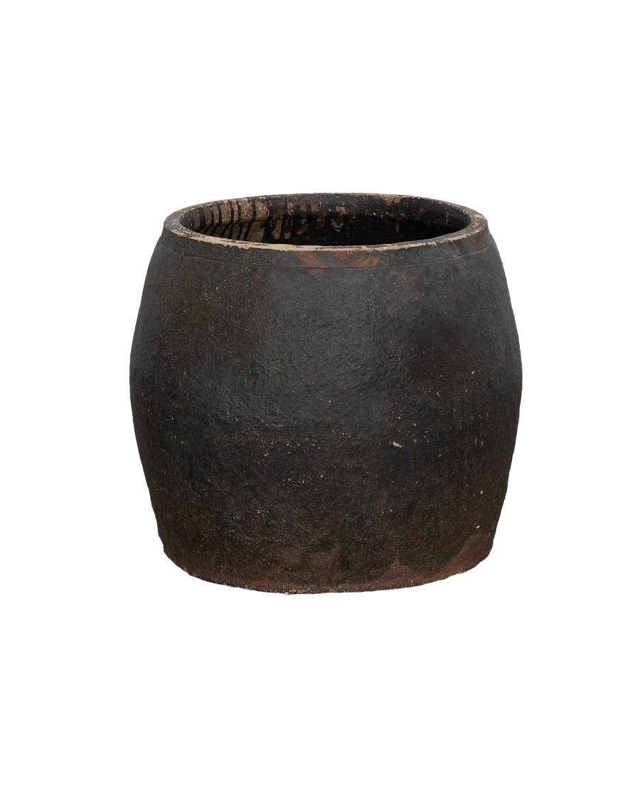 Vintage black ceramic persimmon planter, top rim and interior showing aged texture.