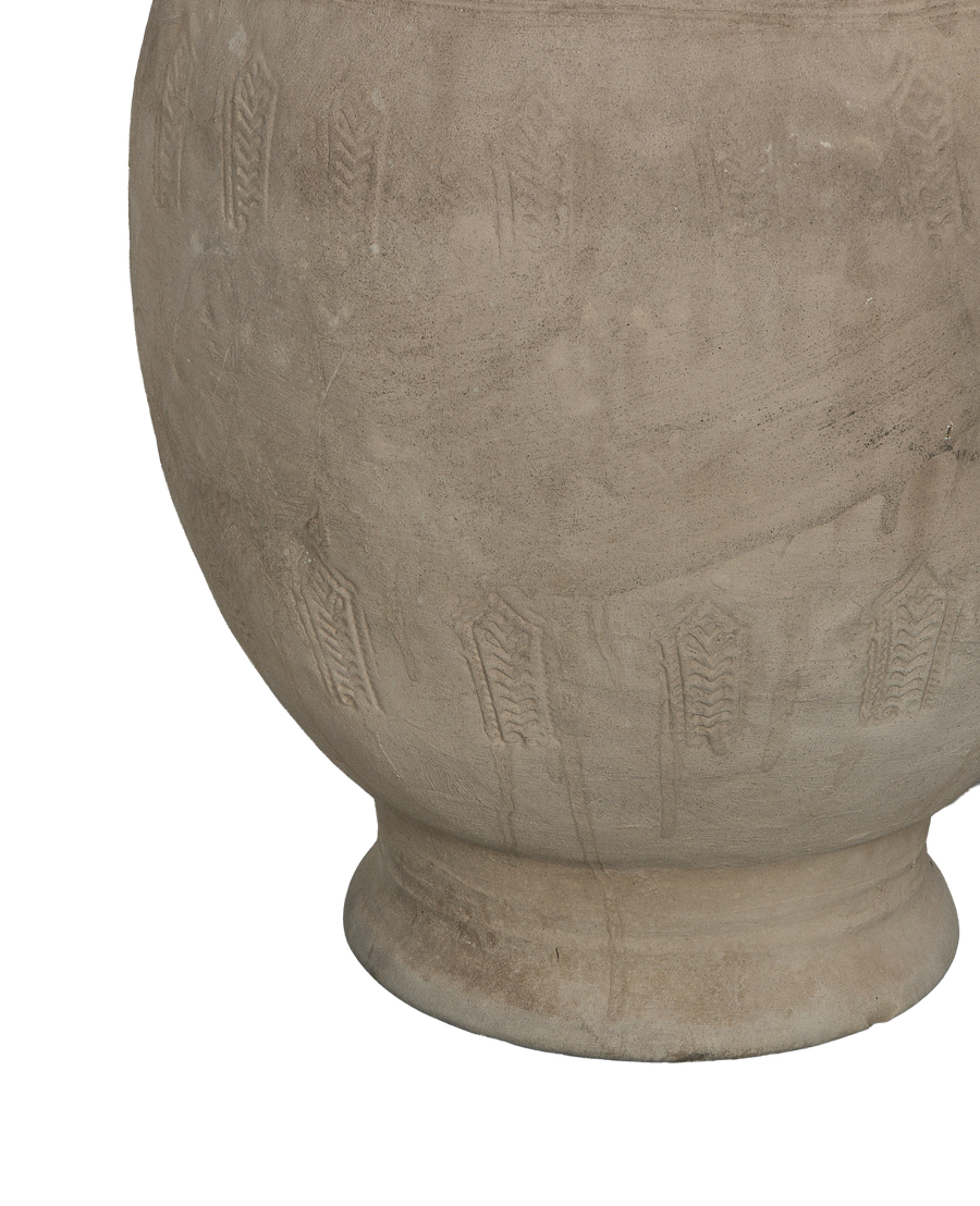 Close-up of vintage Chinese carved relief urn's textured base and decorative band.