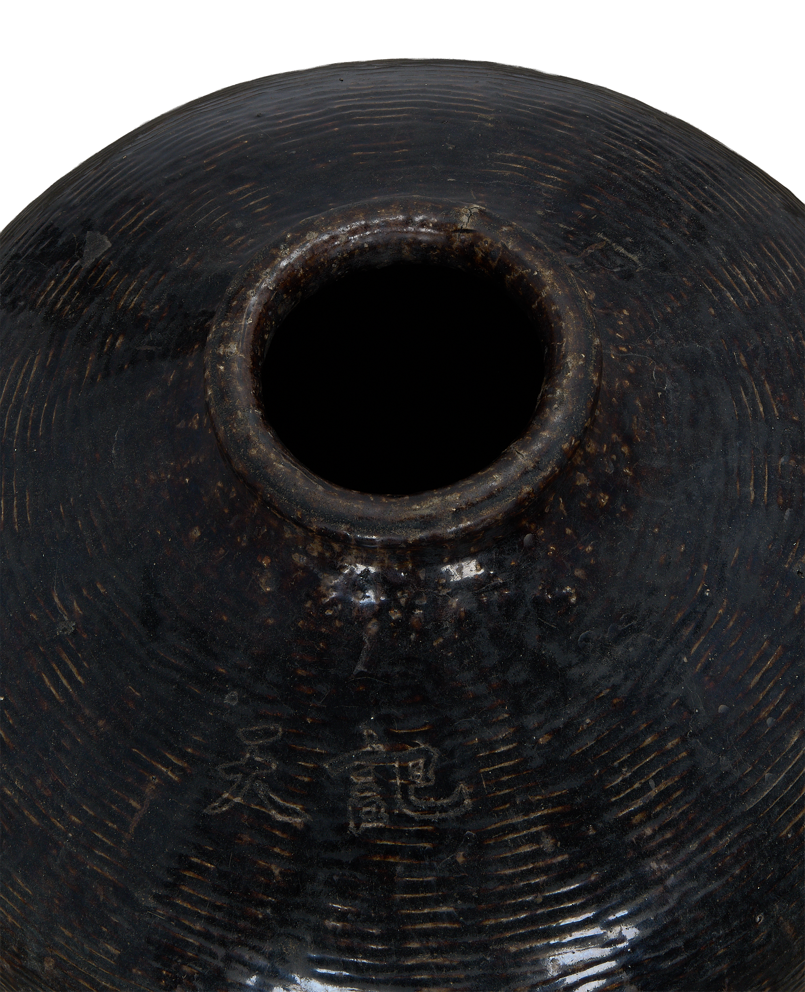 Vintage Chinese Willow Jar, close-up top view showing textured surface, opening, and faint markings.