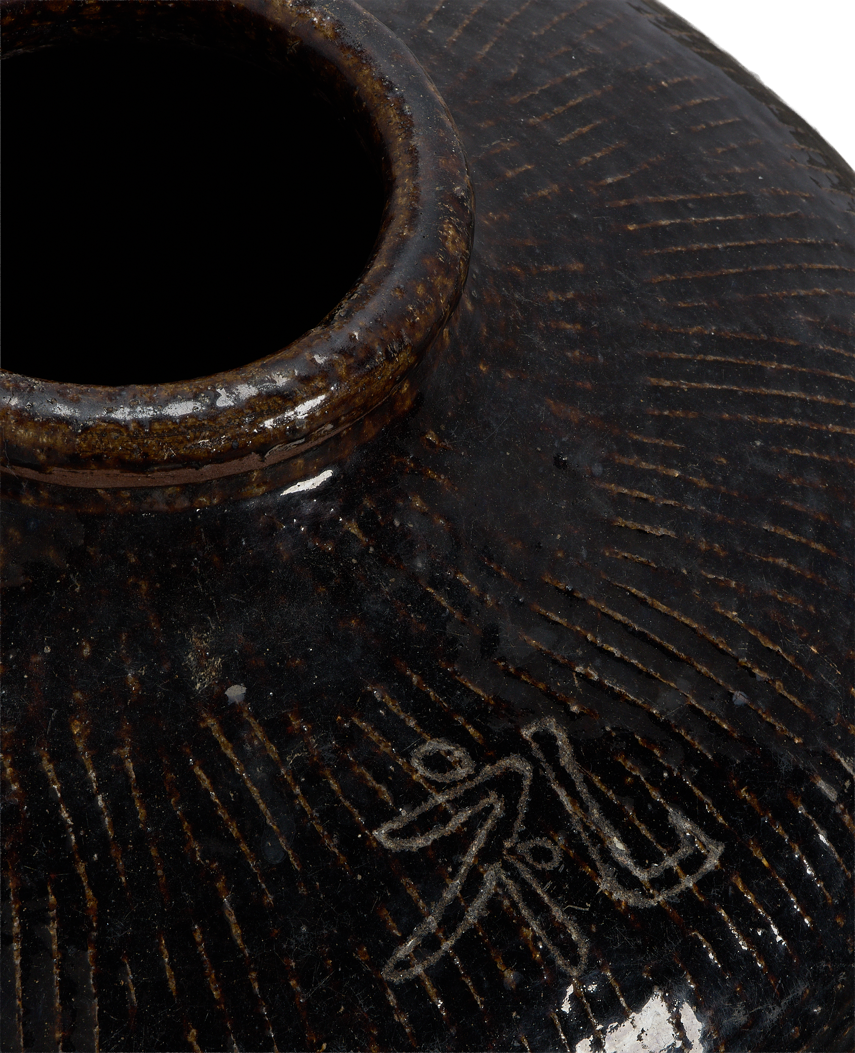 Close-up of vintage Chinese Willow jar's textured ceramic and top rim.