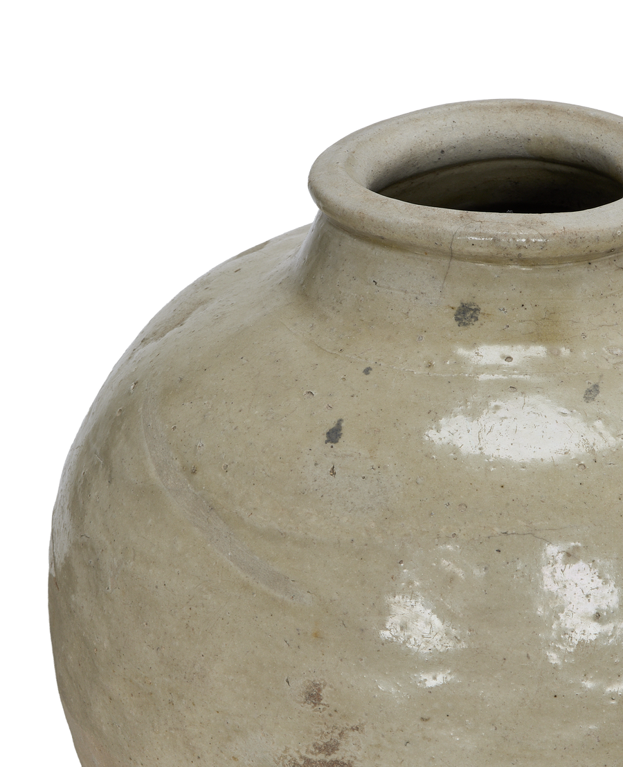 Vintage Chinese amber ceramic jar, showing unique detailed rim and weathered surface texture.