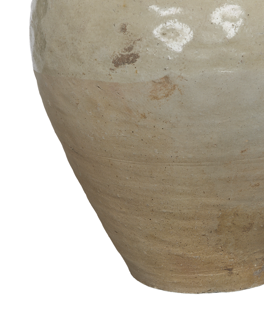 Close-up of vintage Amber Jar's textured, weathered ceramic surface with light glaze.