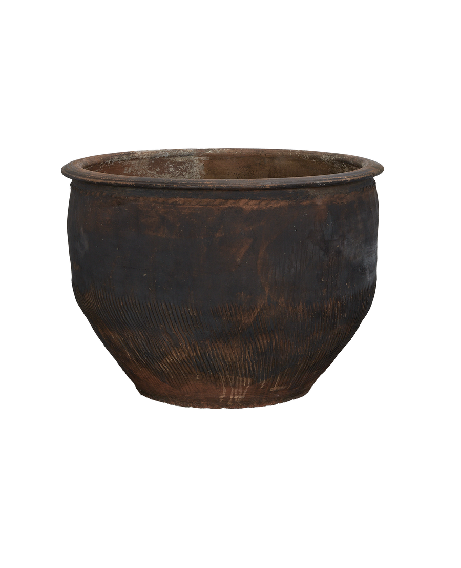 Vintage Chinese earthenware water planter, showing weathered black patinated surface and textured lower body.