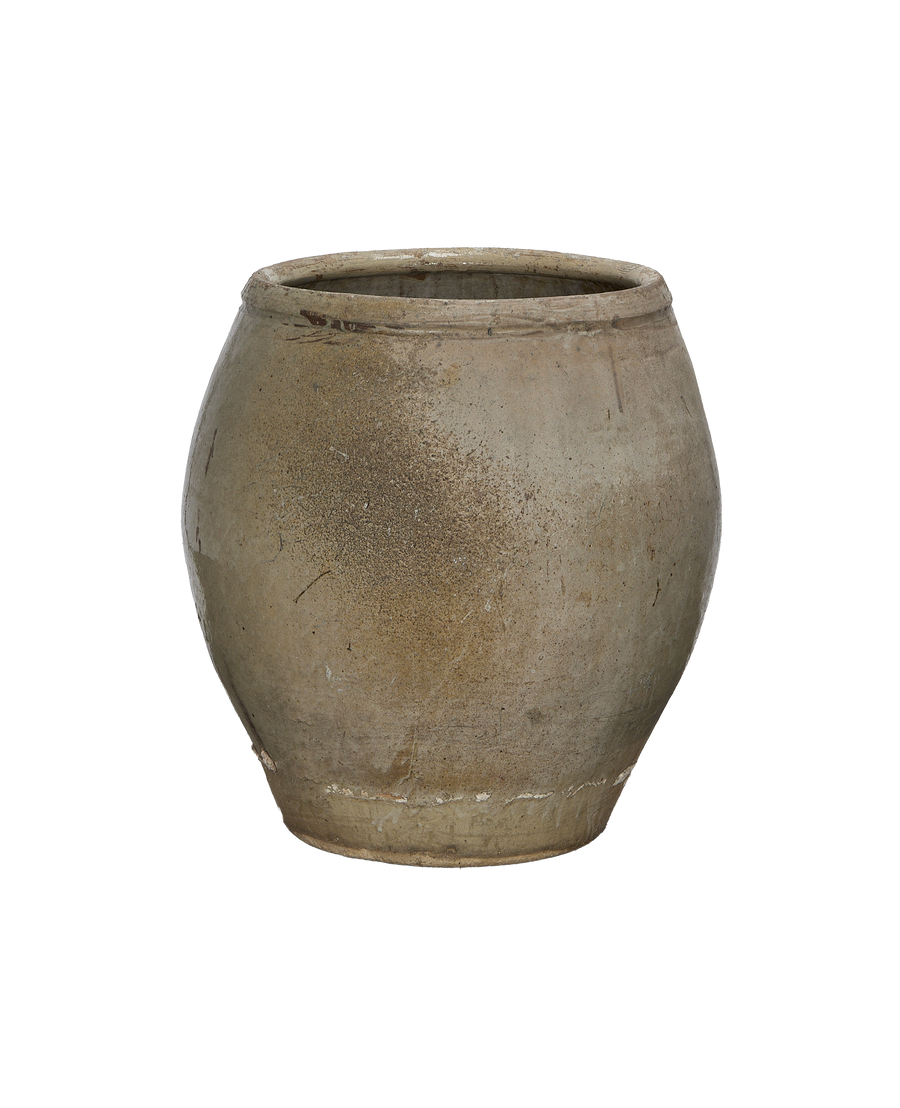 Vintage plum planter, weathered ceramic from China, showing textured surface condition, side view.