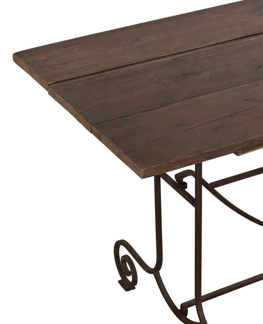 Vintage French oak garden table with weathered top and scrolled wrought iron leg detail.