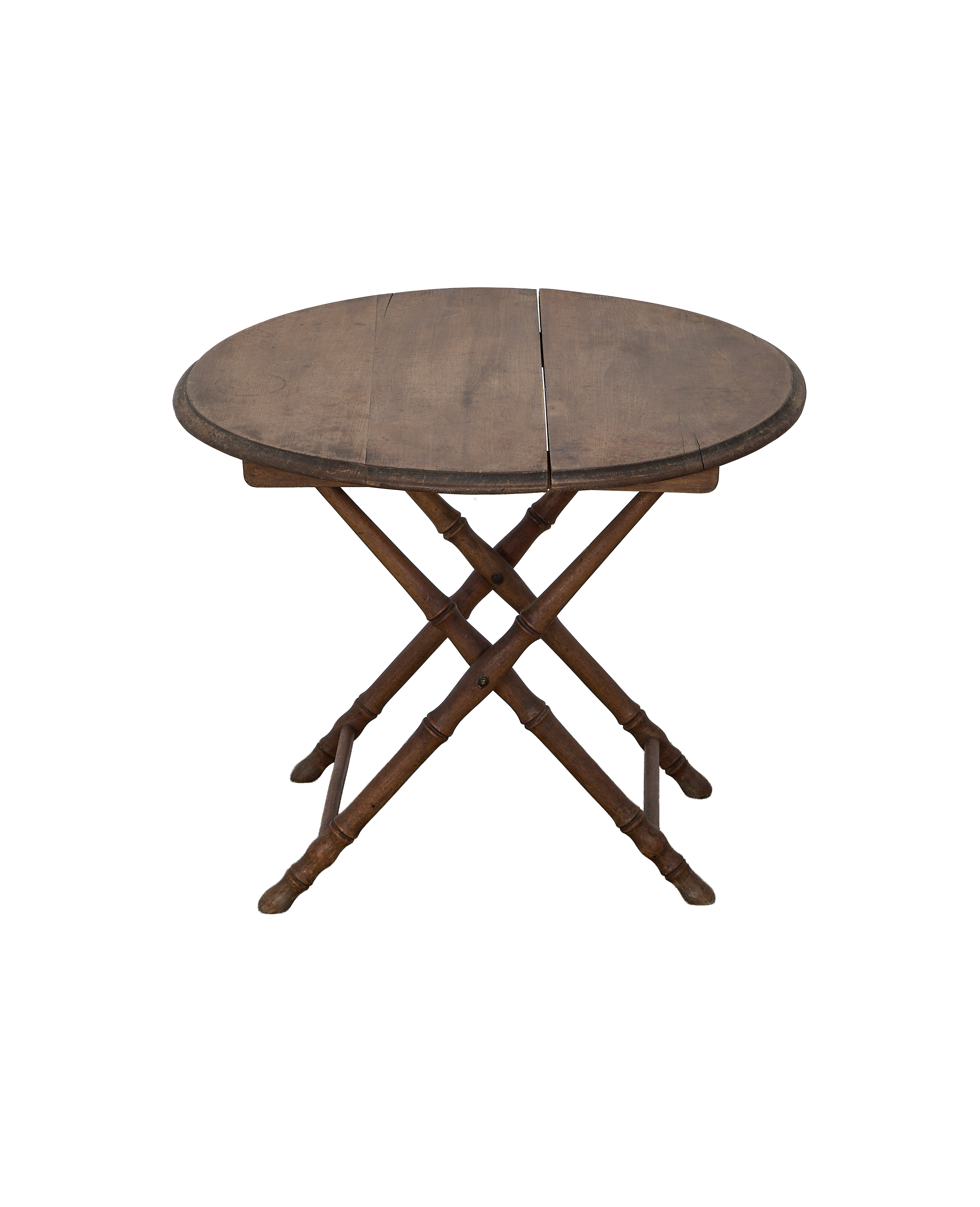 Vintage French bamboo folding table, closed, showing oak grain and folding leg mechanism.