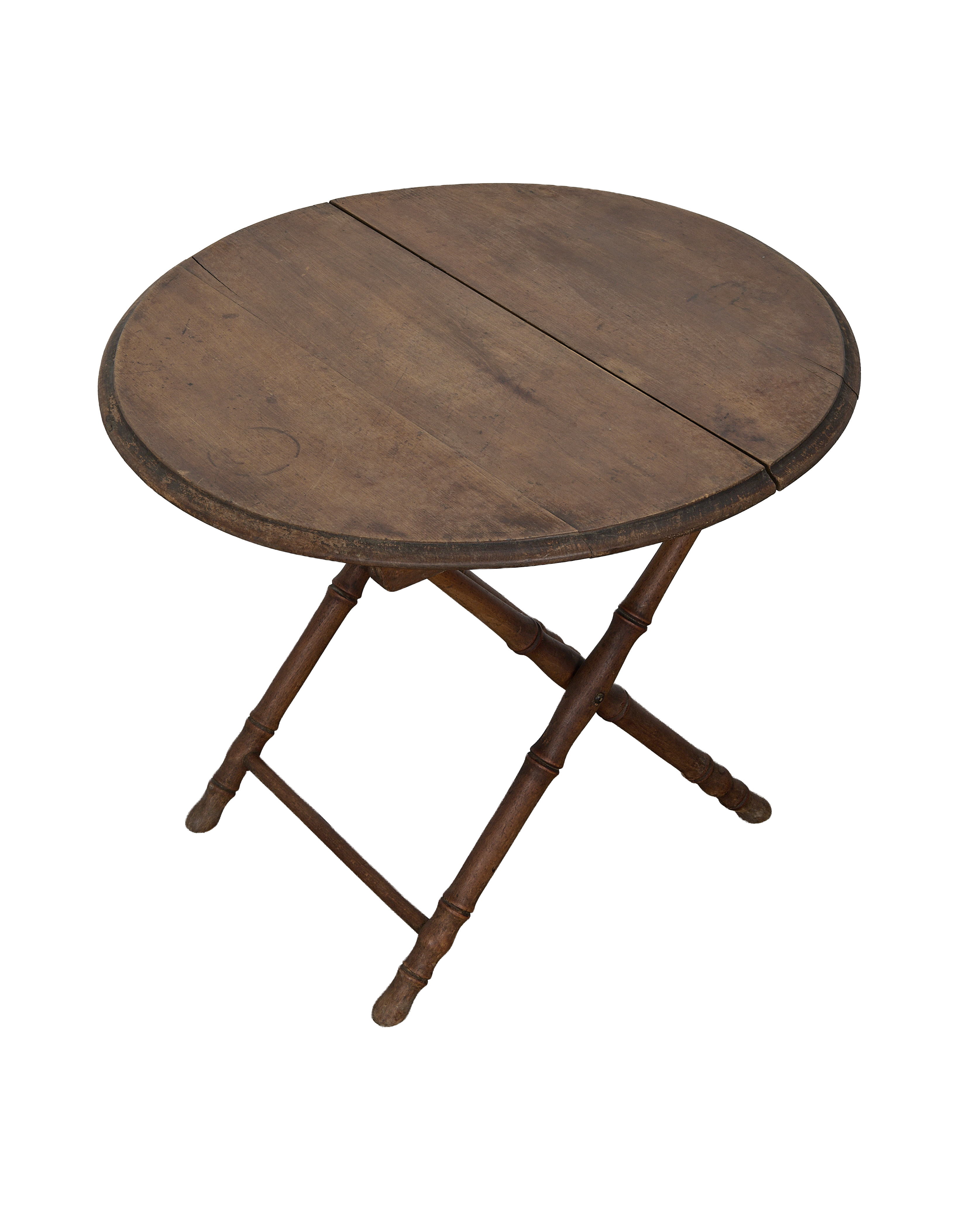 Vintage French oak bamboo folding table, showing circular top with characterful woodgrain and folding mechanism.