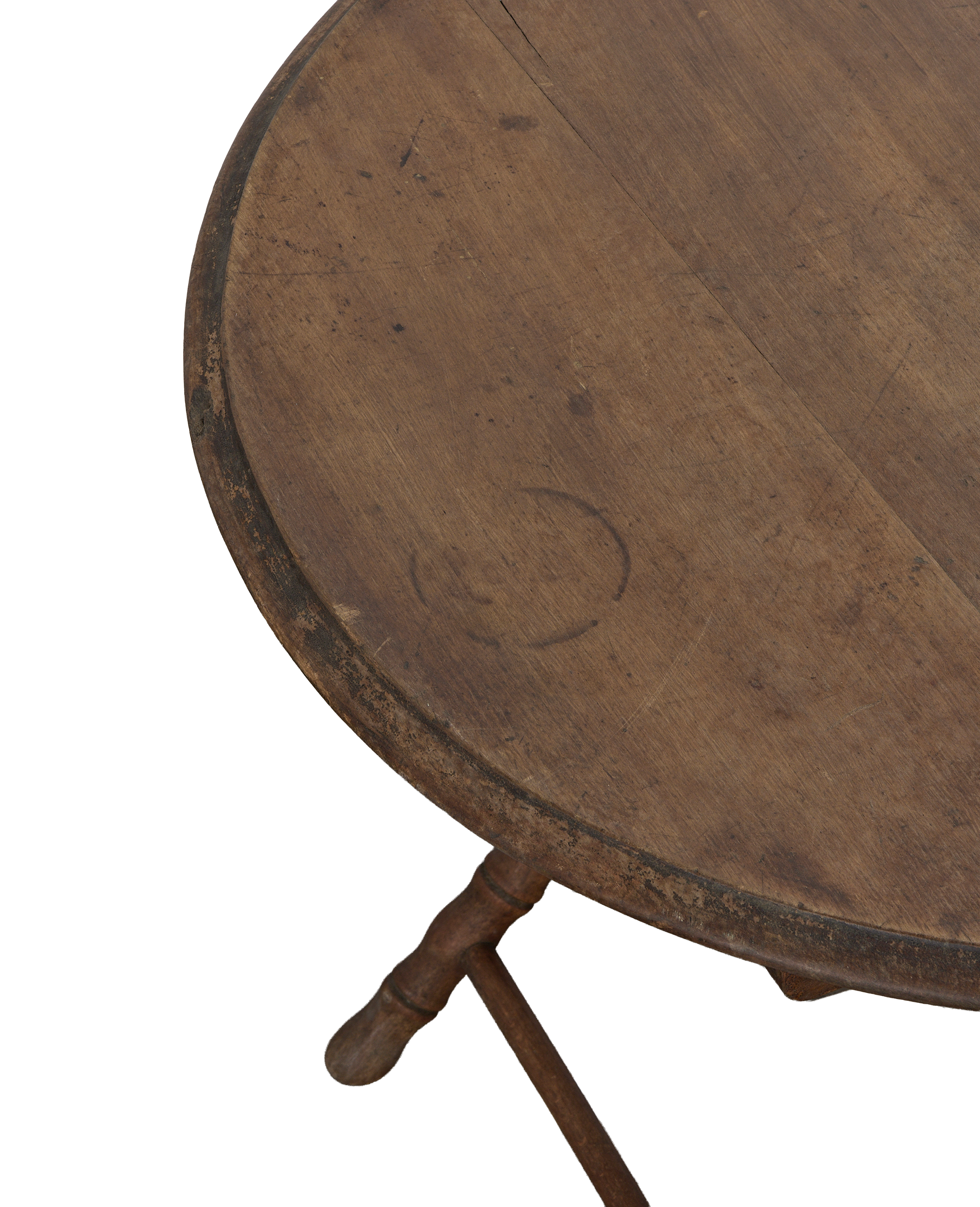 Vintage French oak folding table close-up, showing distressed round top, unique wood grain.