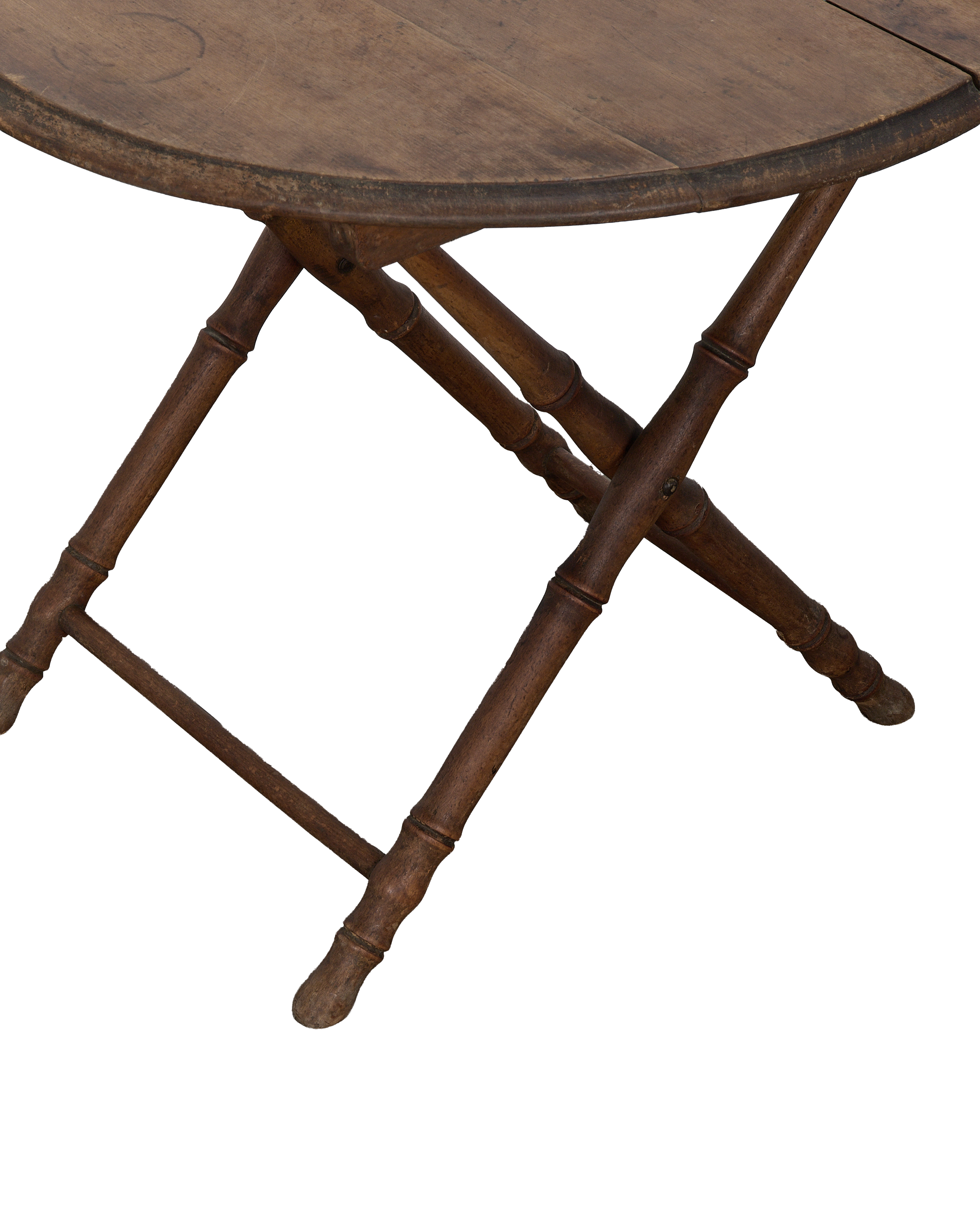 Close-up of vintage French oak folding table legs with bamboo-style turning.