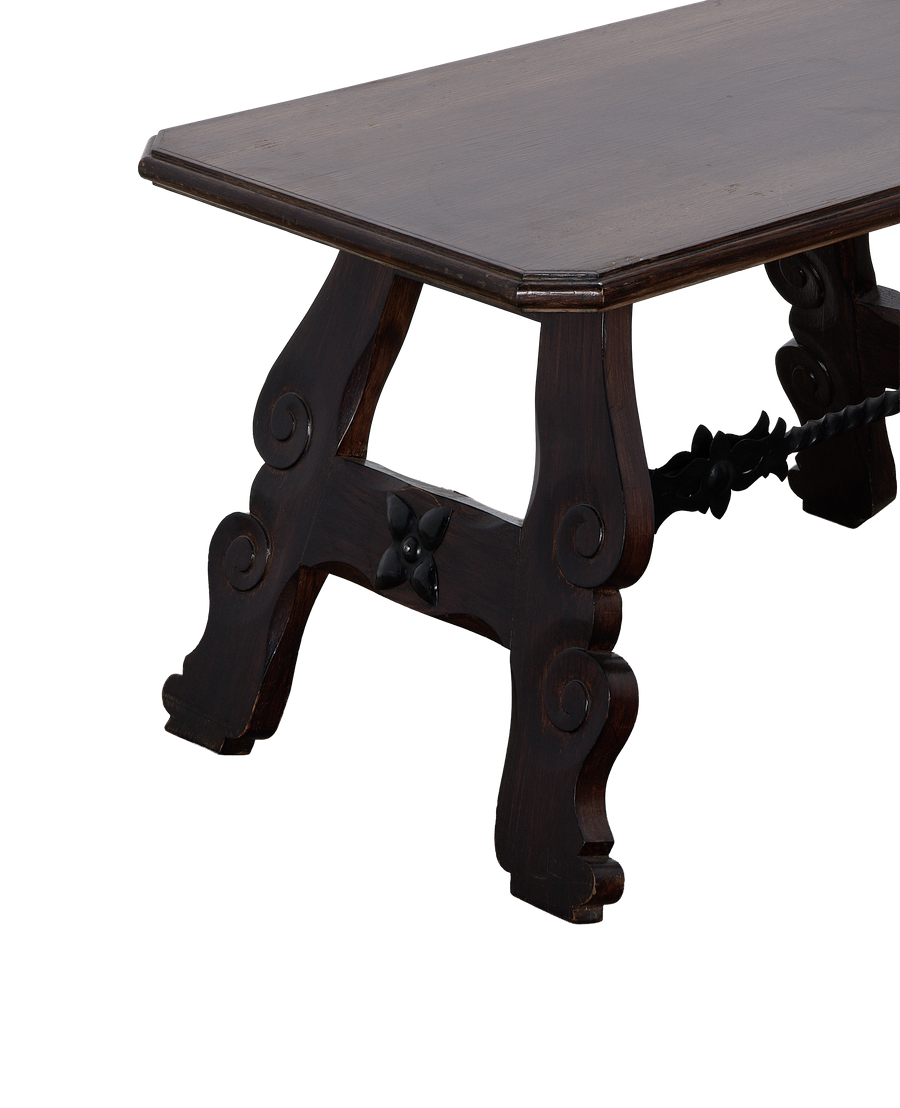 Vintage French oak side table, demonstrating carved leg details and connecting wrought iron support.
