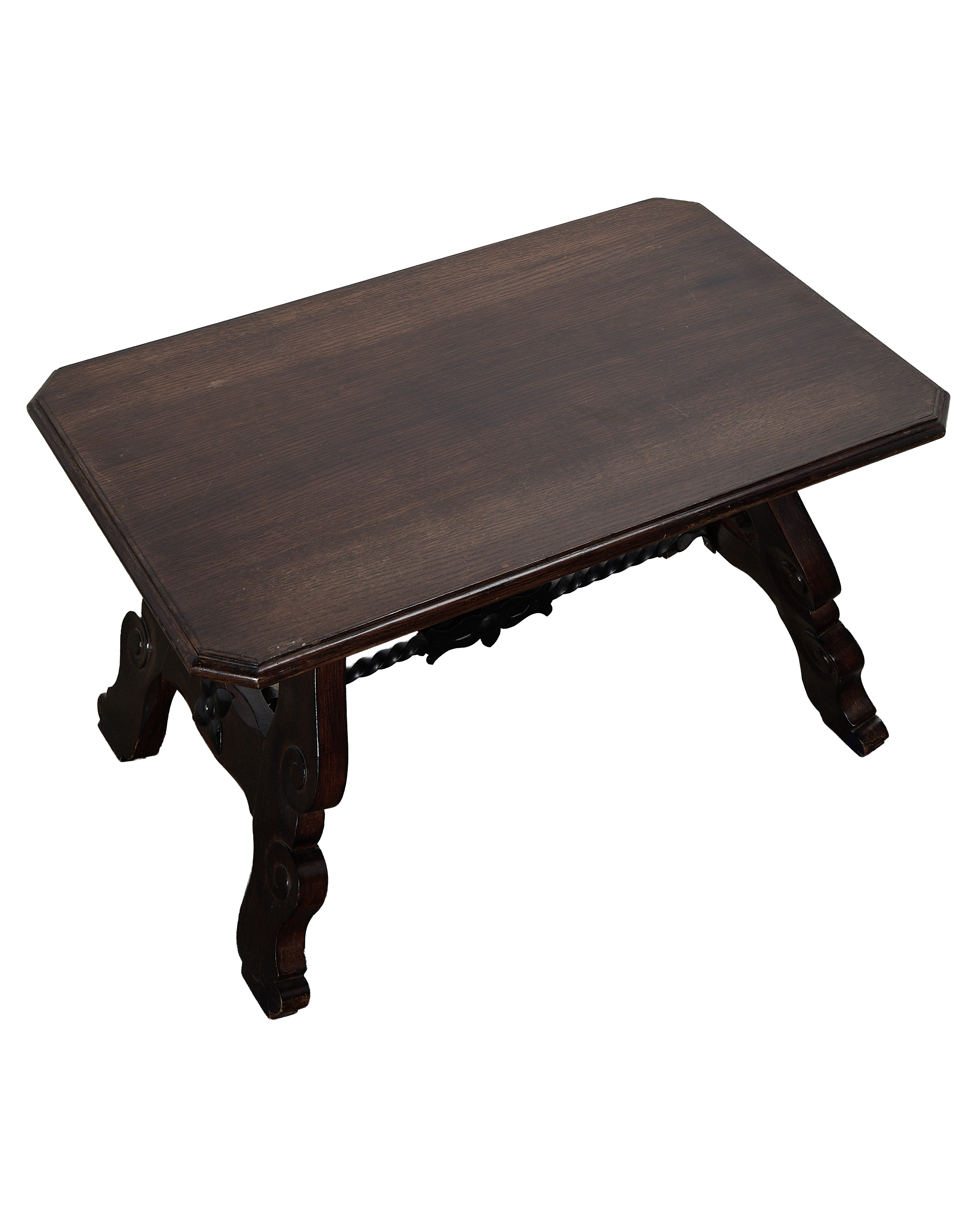 Vintage French oak coffee table, dark wood, ornate carved stretcher, seen from above.