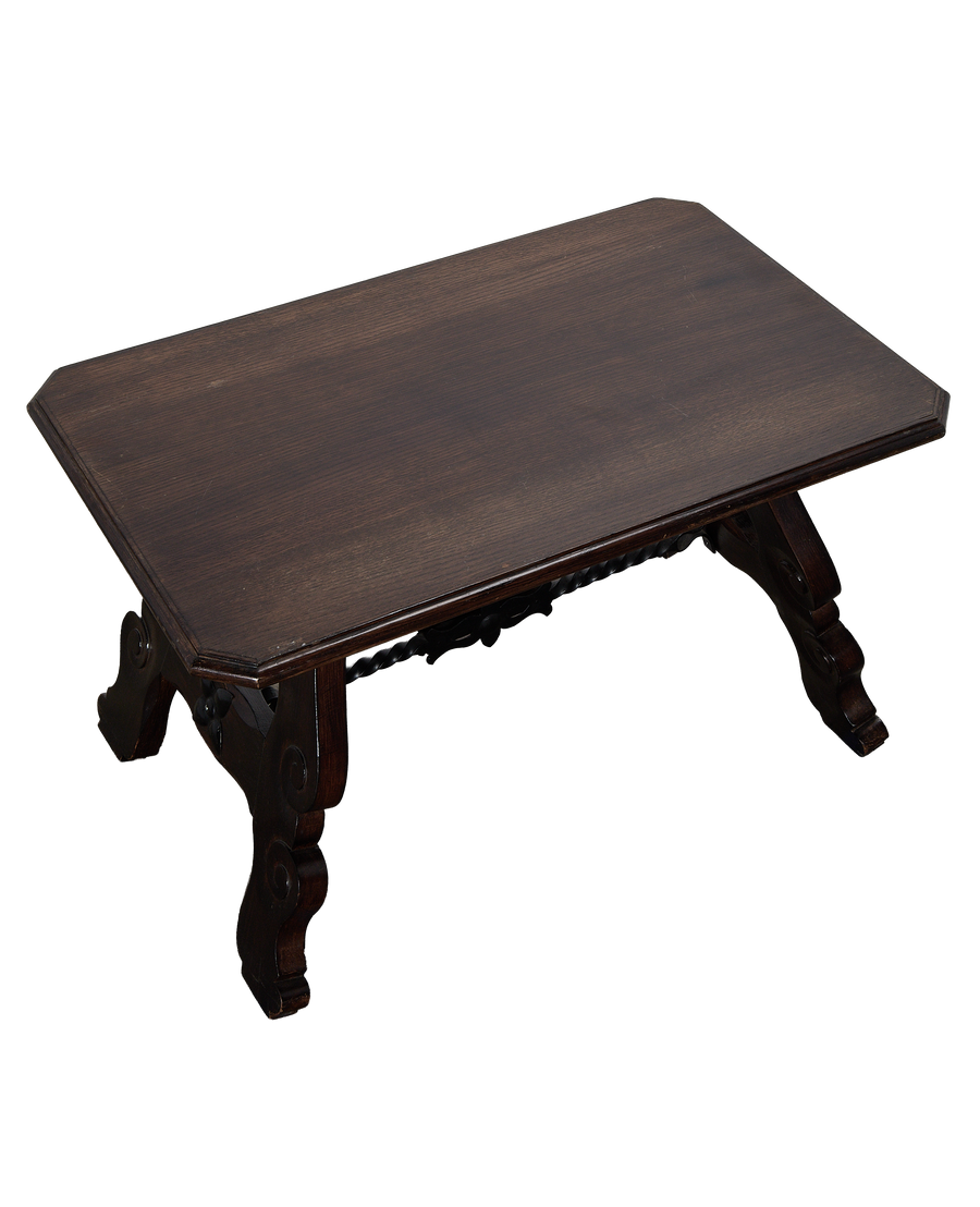 Vintage French oak coffee table, dark wood, ornate carved stretcher, seen from above.