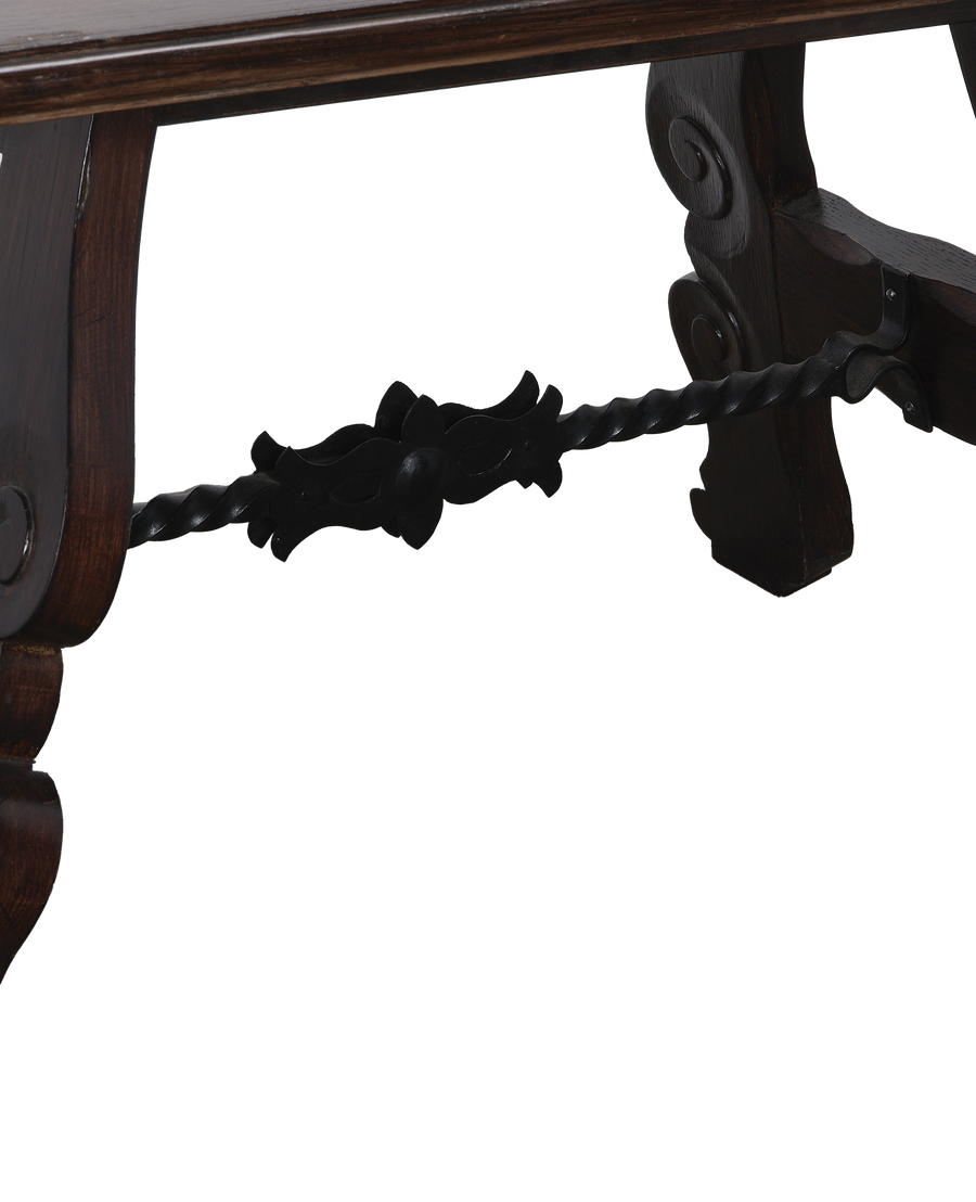 Vintage French oak side table showing close-up of decorative twisted iron stretcher.