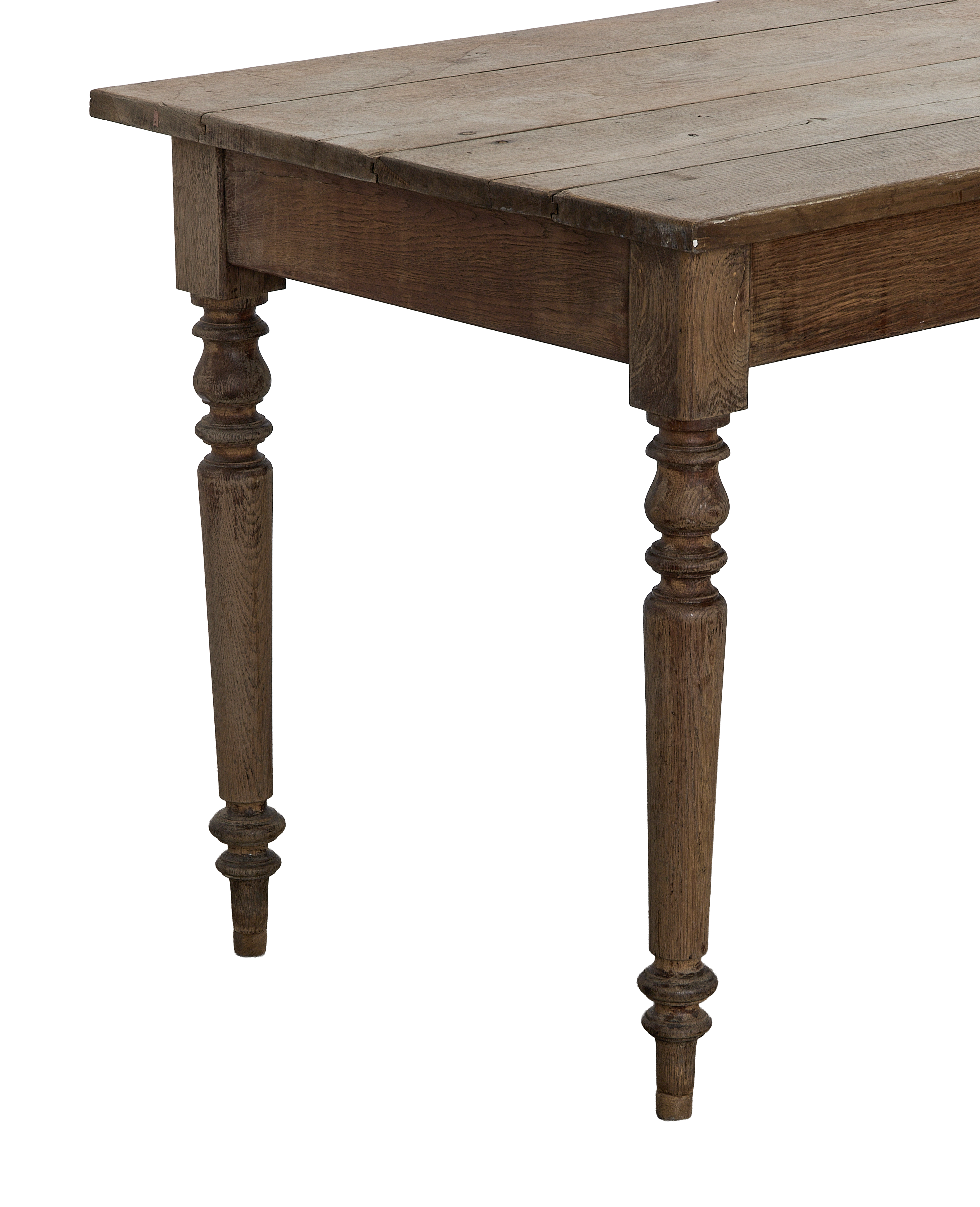 Vintage French oak farm table, showing detailed turned legs and distressed tabletop planks.