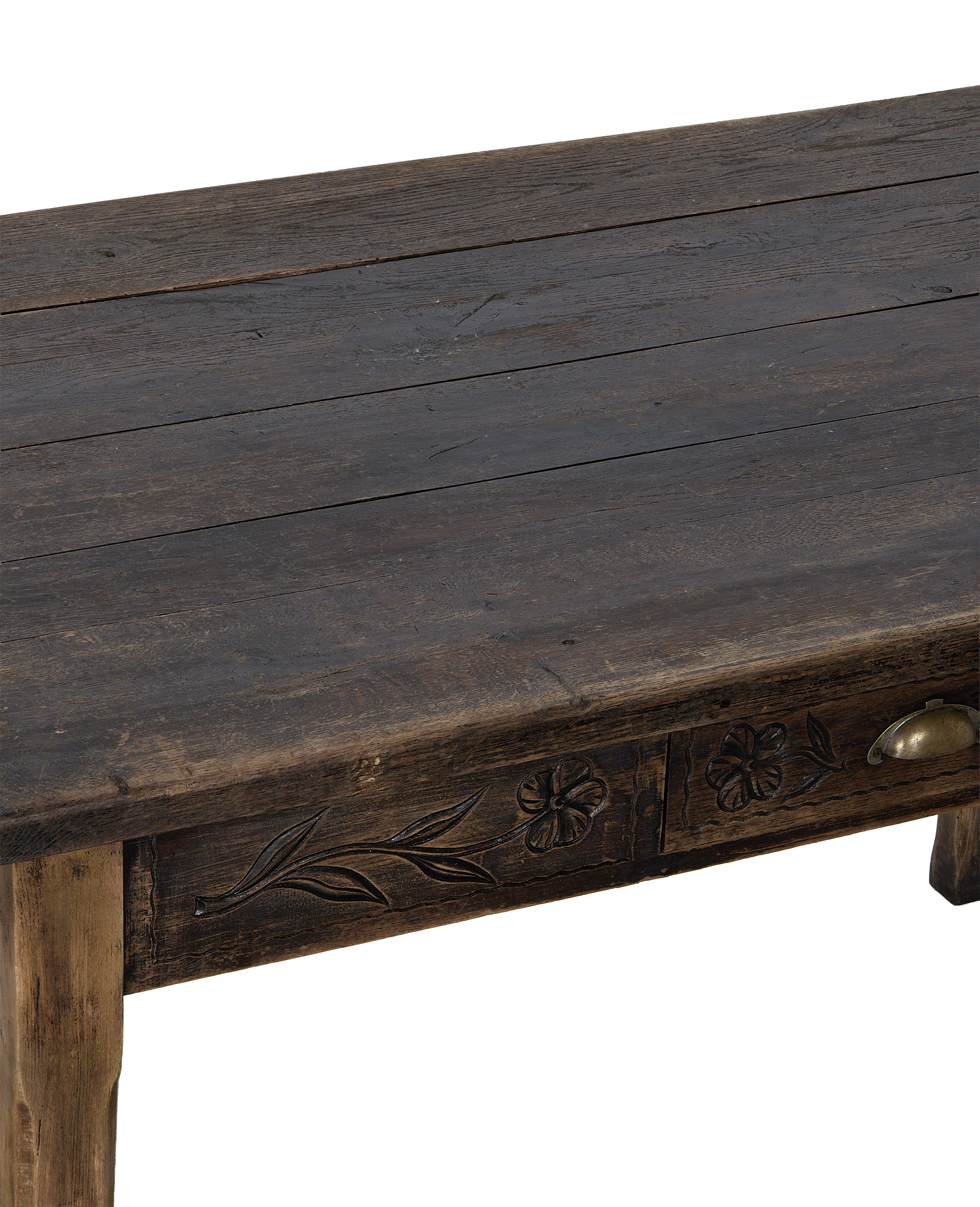 Vintage French oak drawer table, close-up showing carved floral detail and brass pull.