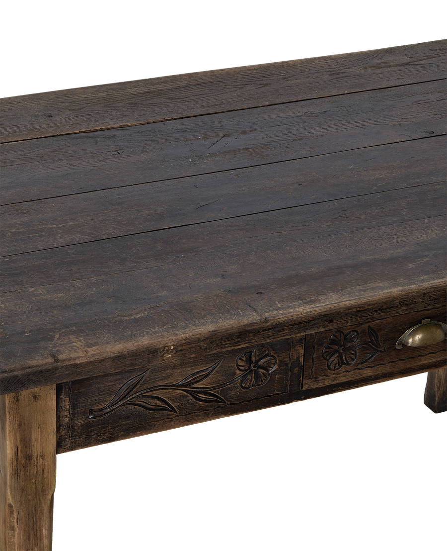Vintage French oak drawer table, close-up showing carved floral detail and brass pull.