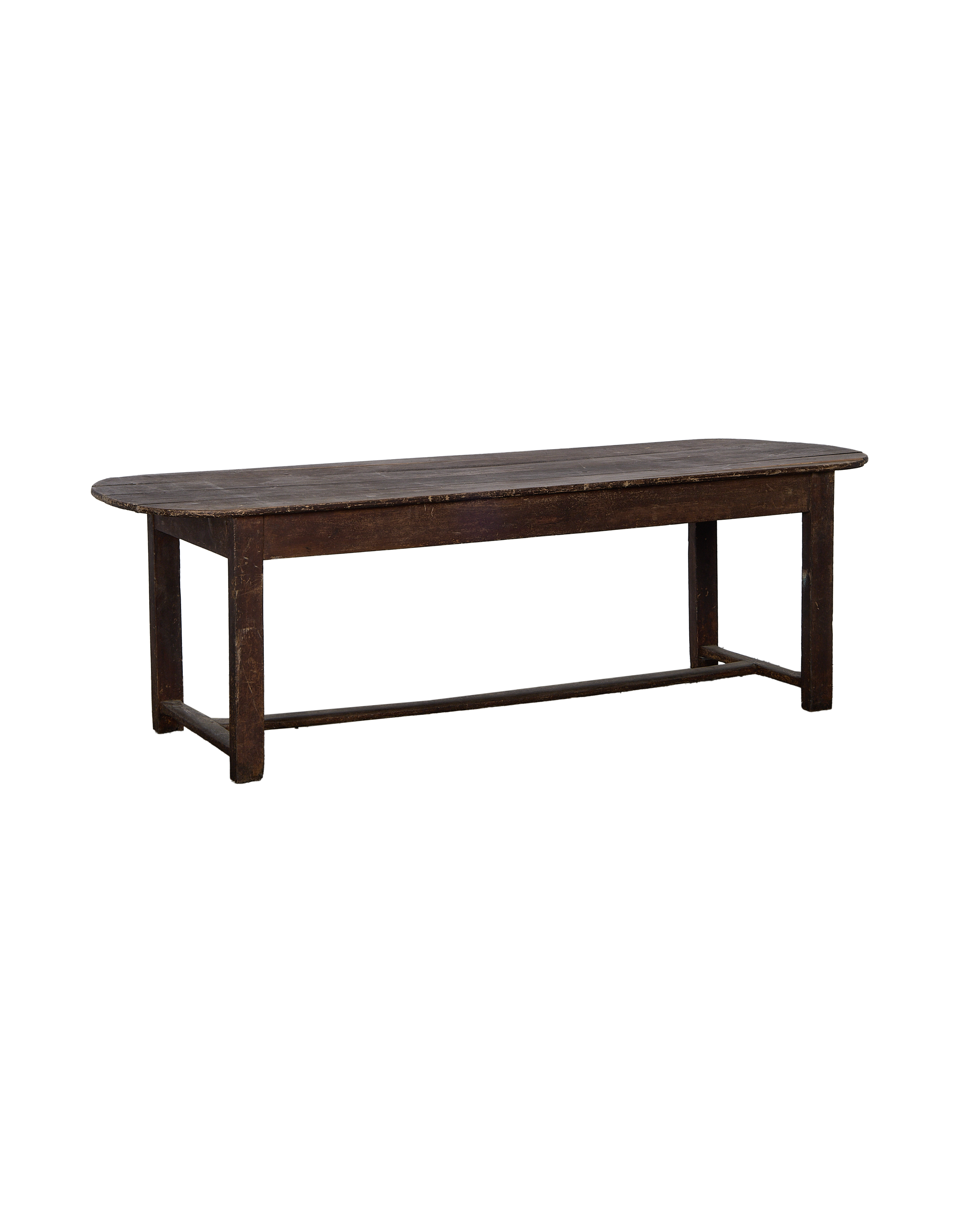 Vintage French oak oval table, dark wood with distressed finish, front view.