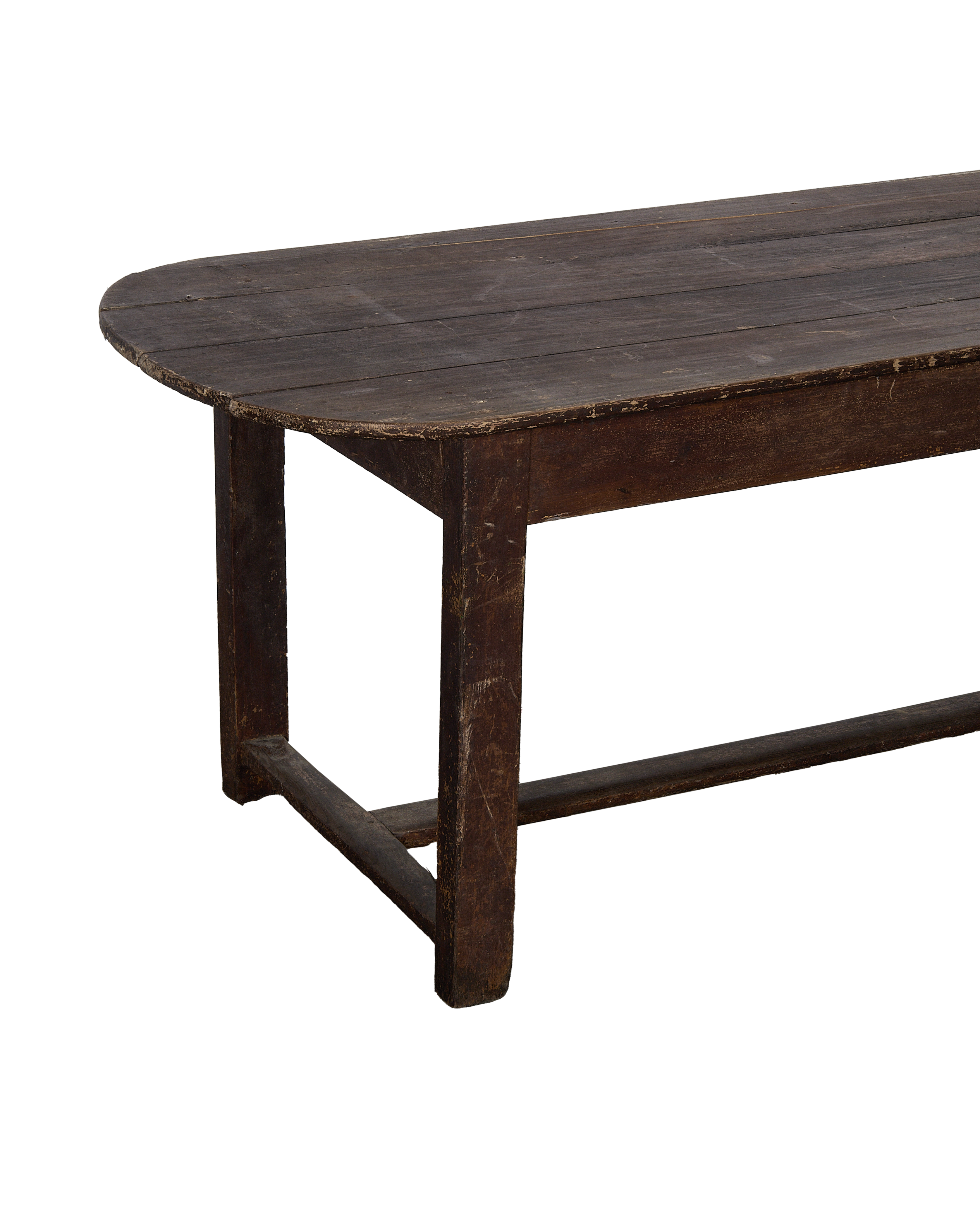 Vintage French oval oak table showing weathered wood top and distressed leg detail.