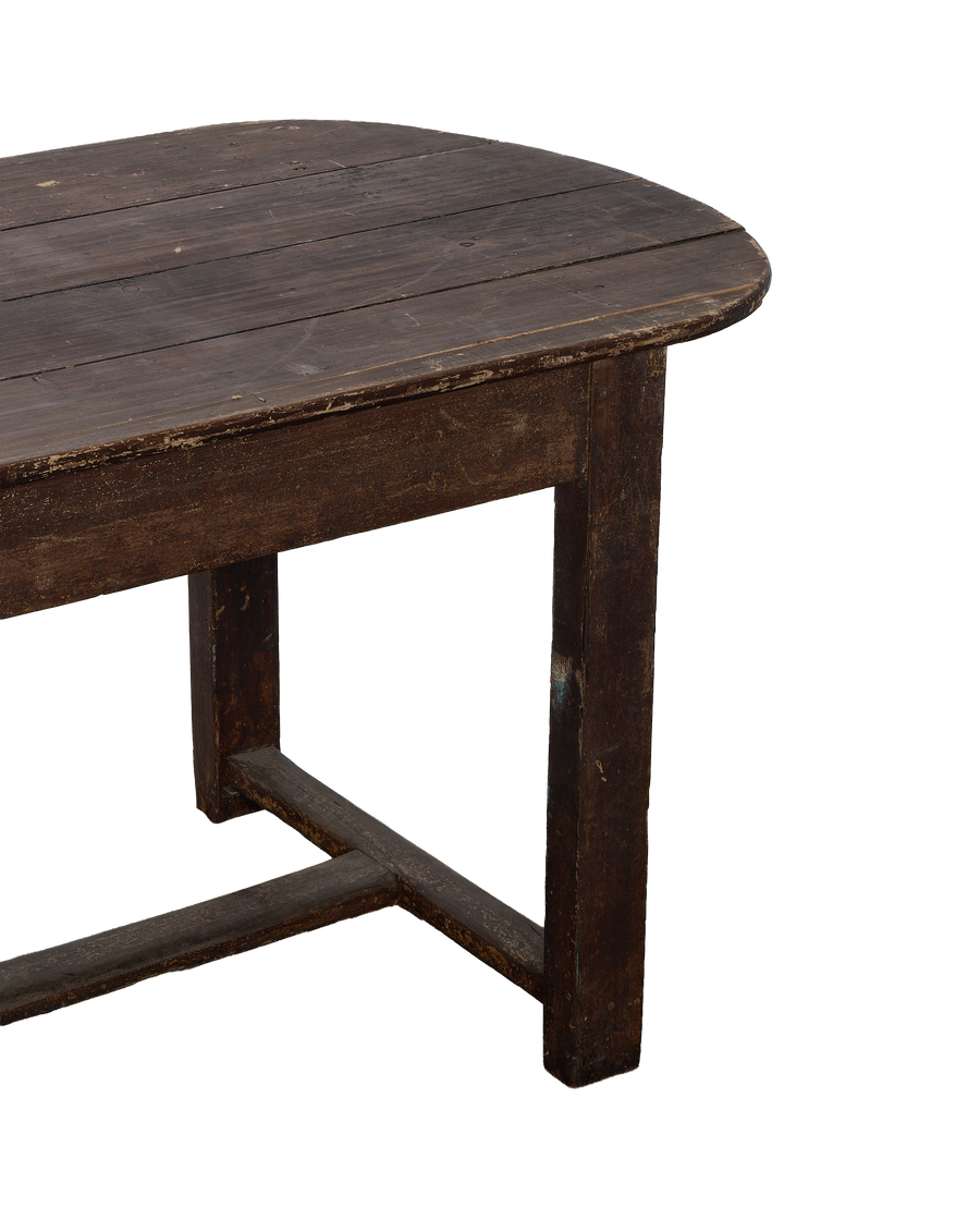 Vintage French oval oak table, closeup showing aged wood grain and condition.