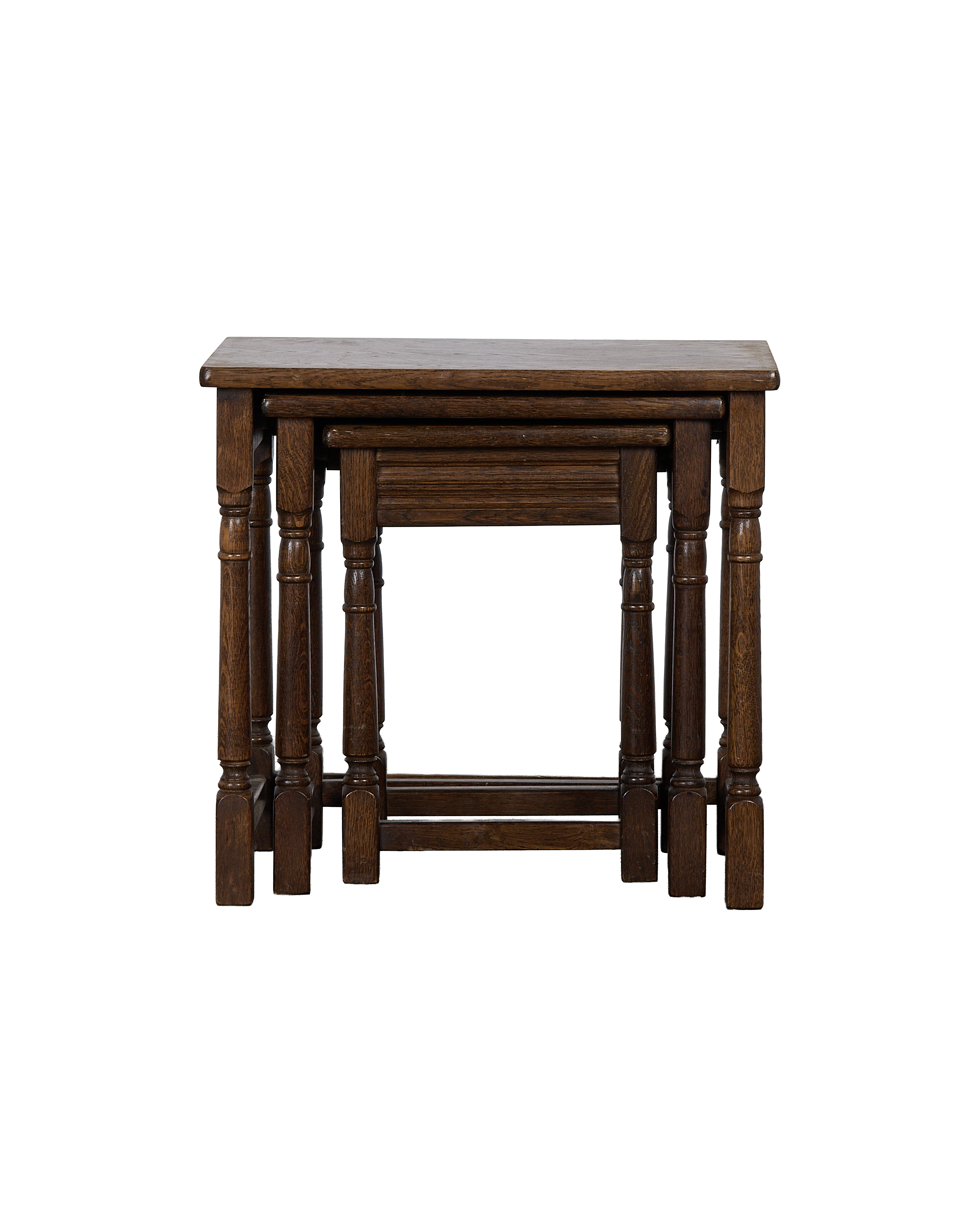 Vintage French oak barley twist nesting tables nested together, showing natural wear.