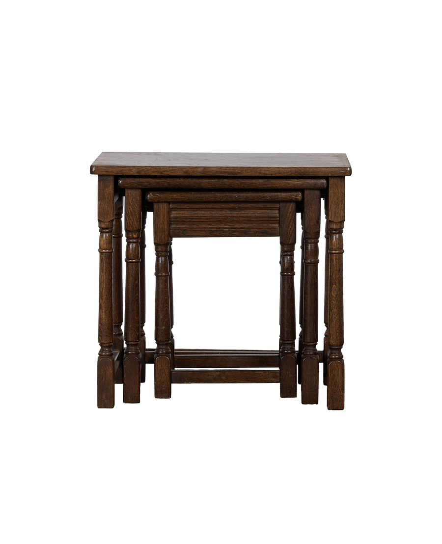 Vintage French oak barley twist nesting tables nested together, showing natural wear.