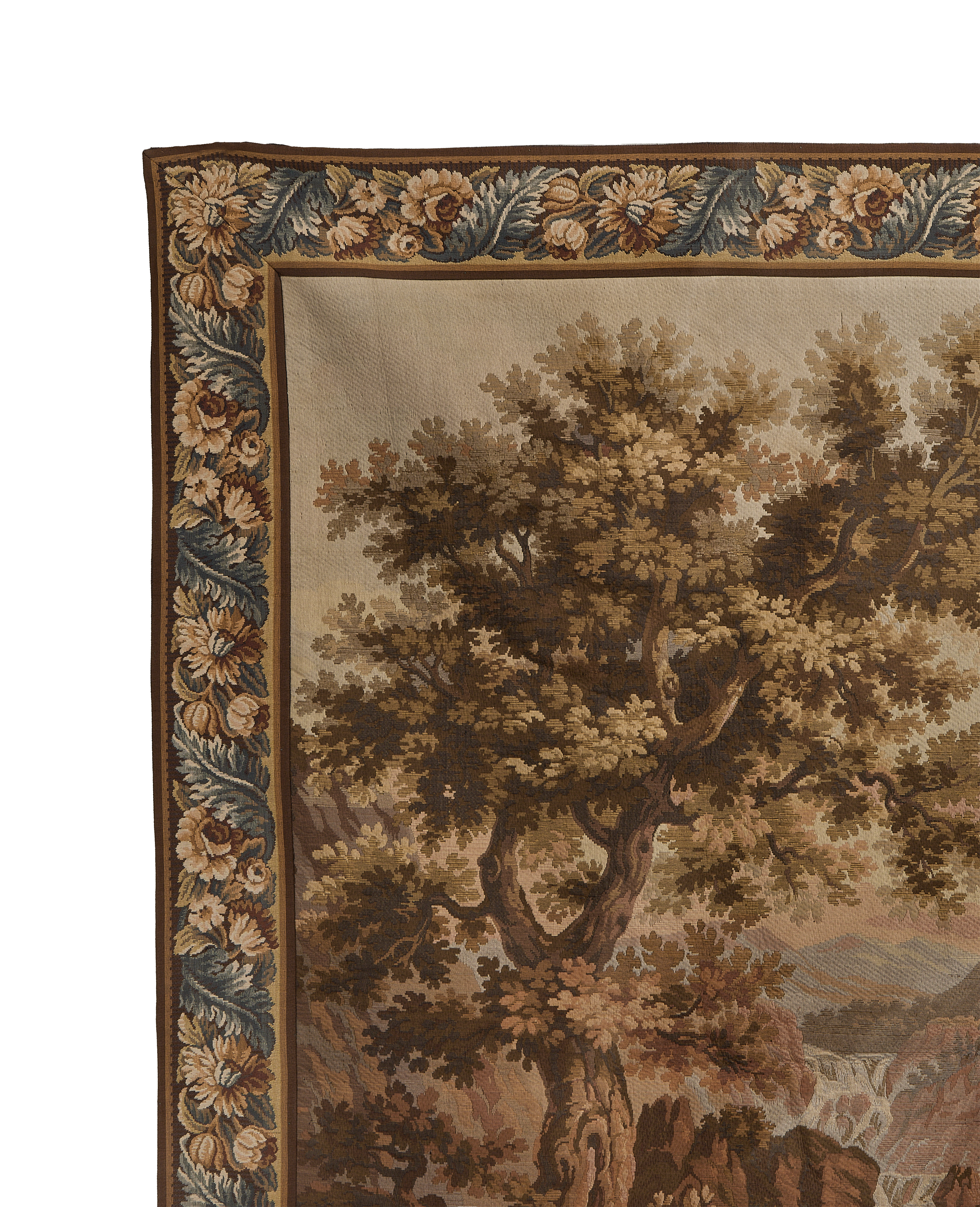 Vintage French tapestry with oak trees, floral border detail, and muted earthy tones.