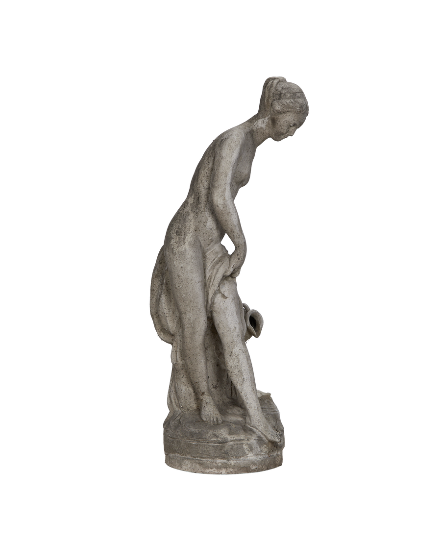 Vintage French woman statue, weathered concrete, elegant side view of figure bending.