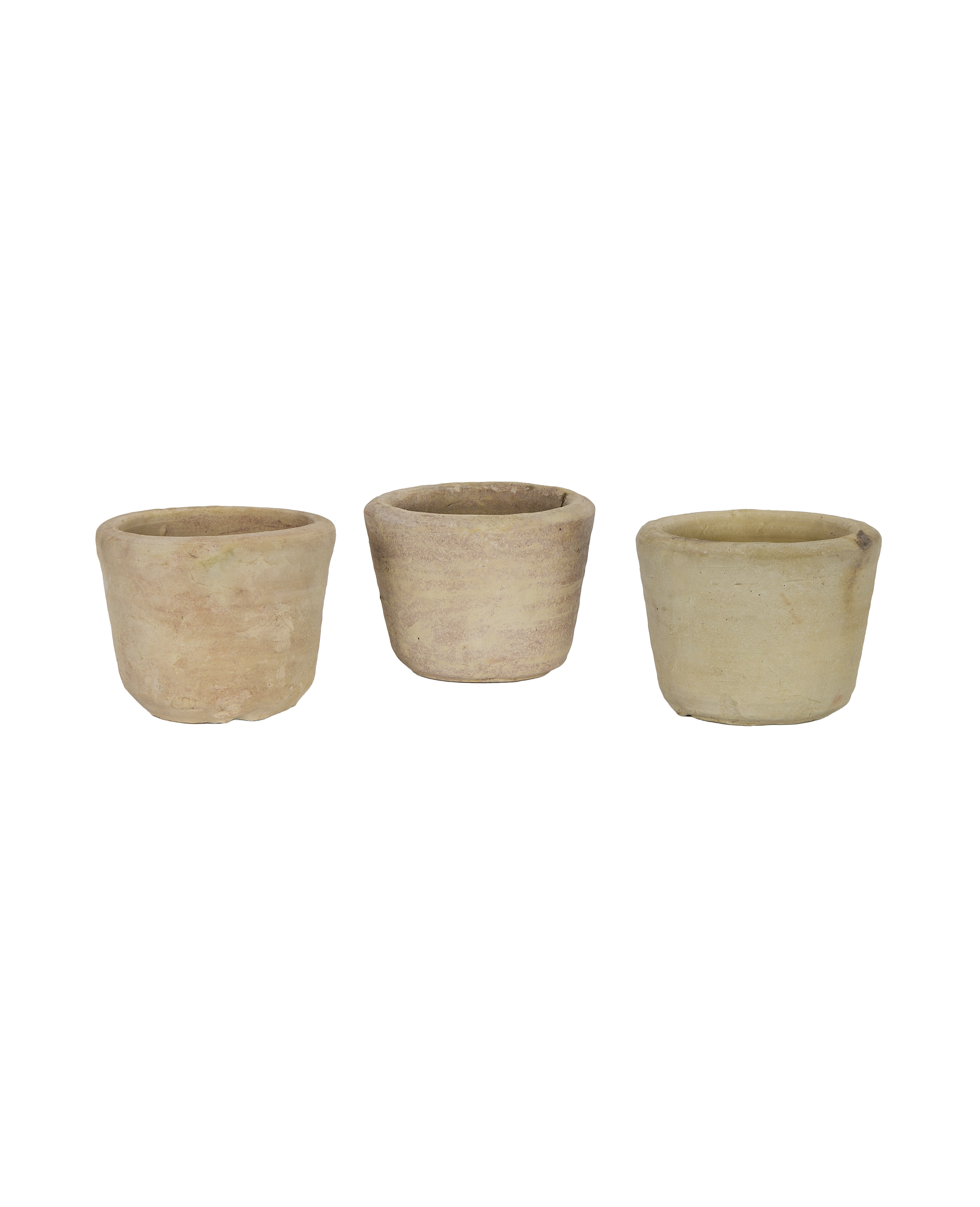 Three vintage French orangerie pots in light terracotta, showcasing varied textures and hues.