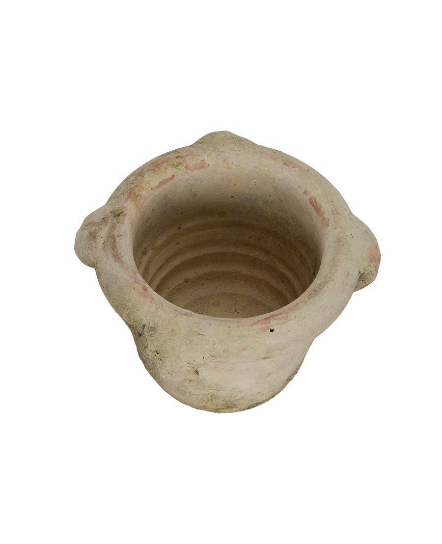 Vintage French orangerie pot, top-down view showing interior rings and weathered texture.