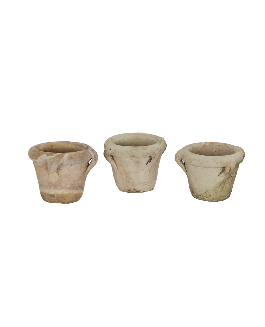 Three vintage French Orangerie handle pots, showing weathered patinas and varied textures.