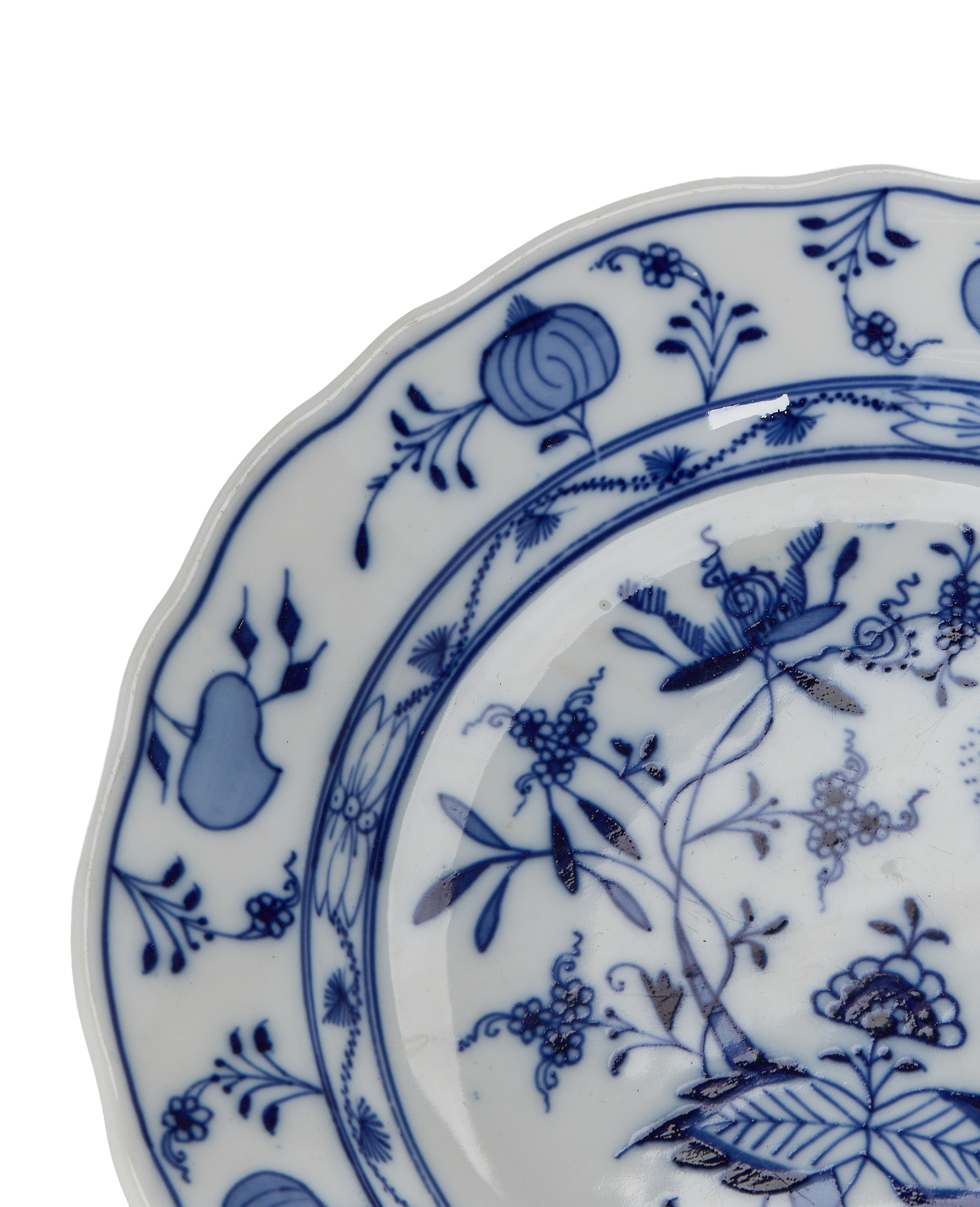 Close-up of vintage French Onion Plate showing intricate blue floral porcelain pattern.