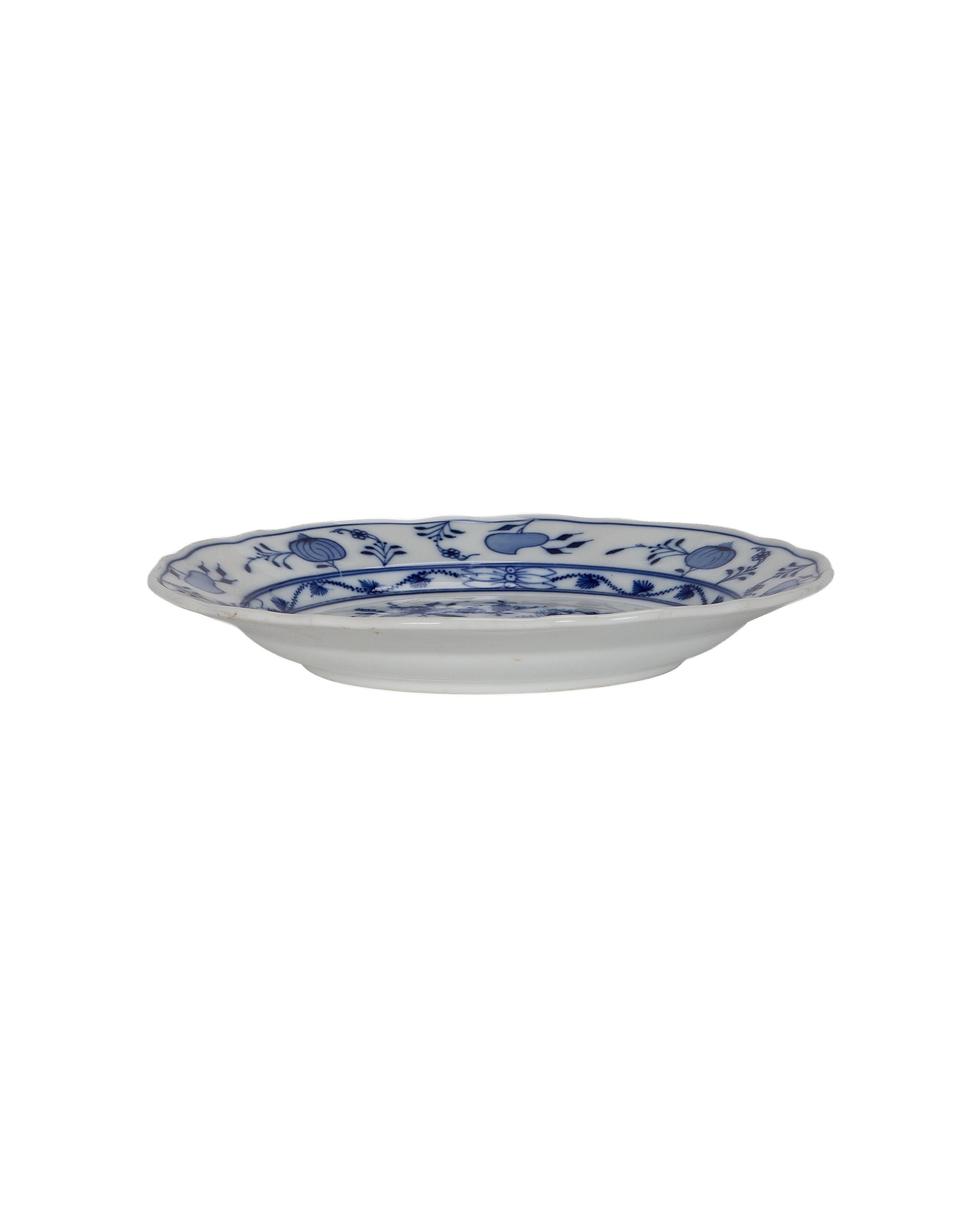 Vintage French porcelain Onion Plate, side view displaying scalloped edge and blue floral pattern.