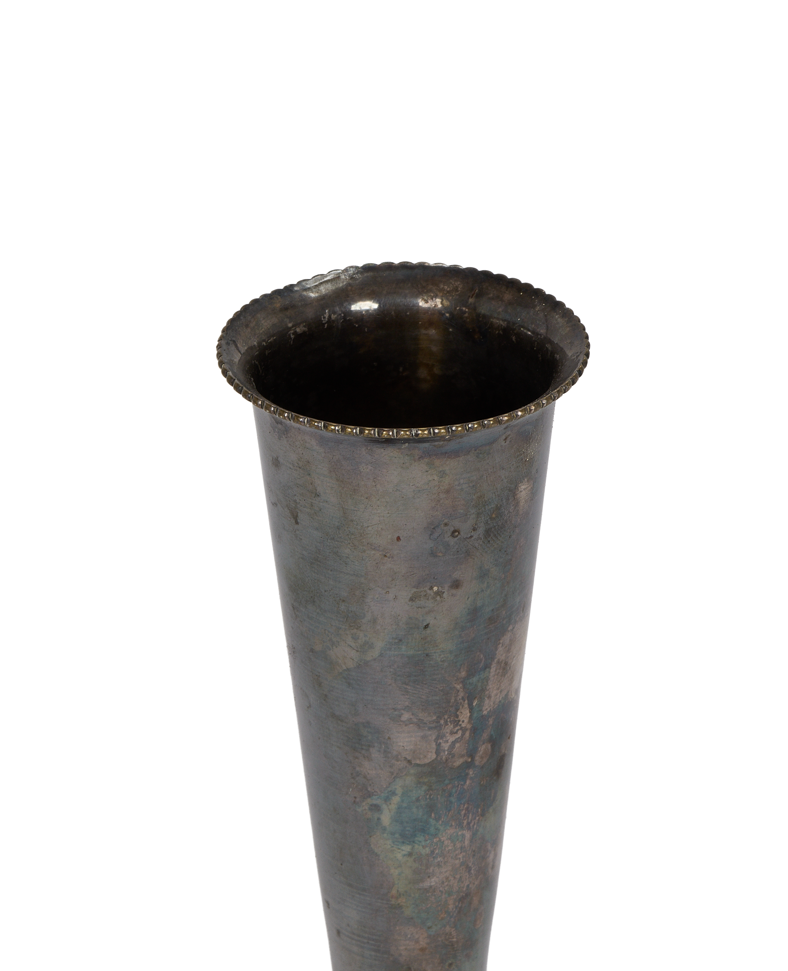 Vintage French Deco pewter bud vase, showing aged patina and ornate scalloped rim detail.