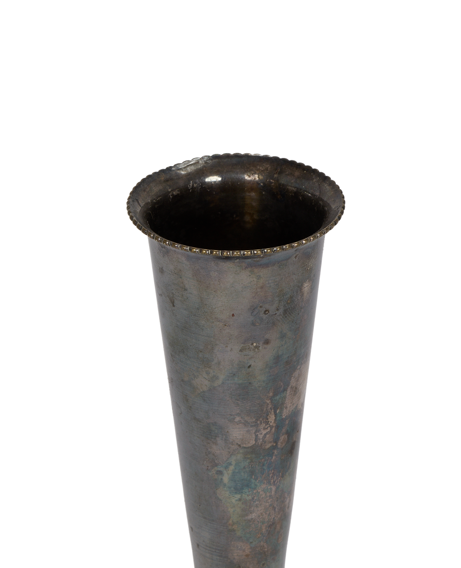 Vintage French Deco pewter bud vase, showing aged patina and ornate scalloped rim detail.