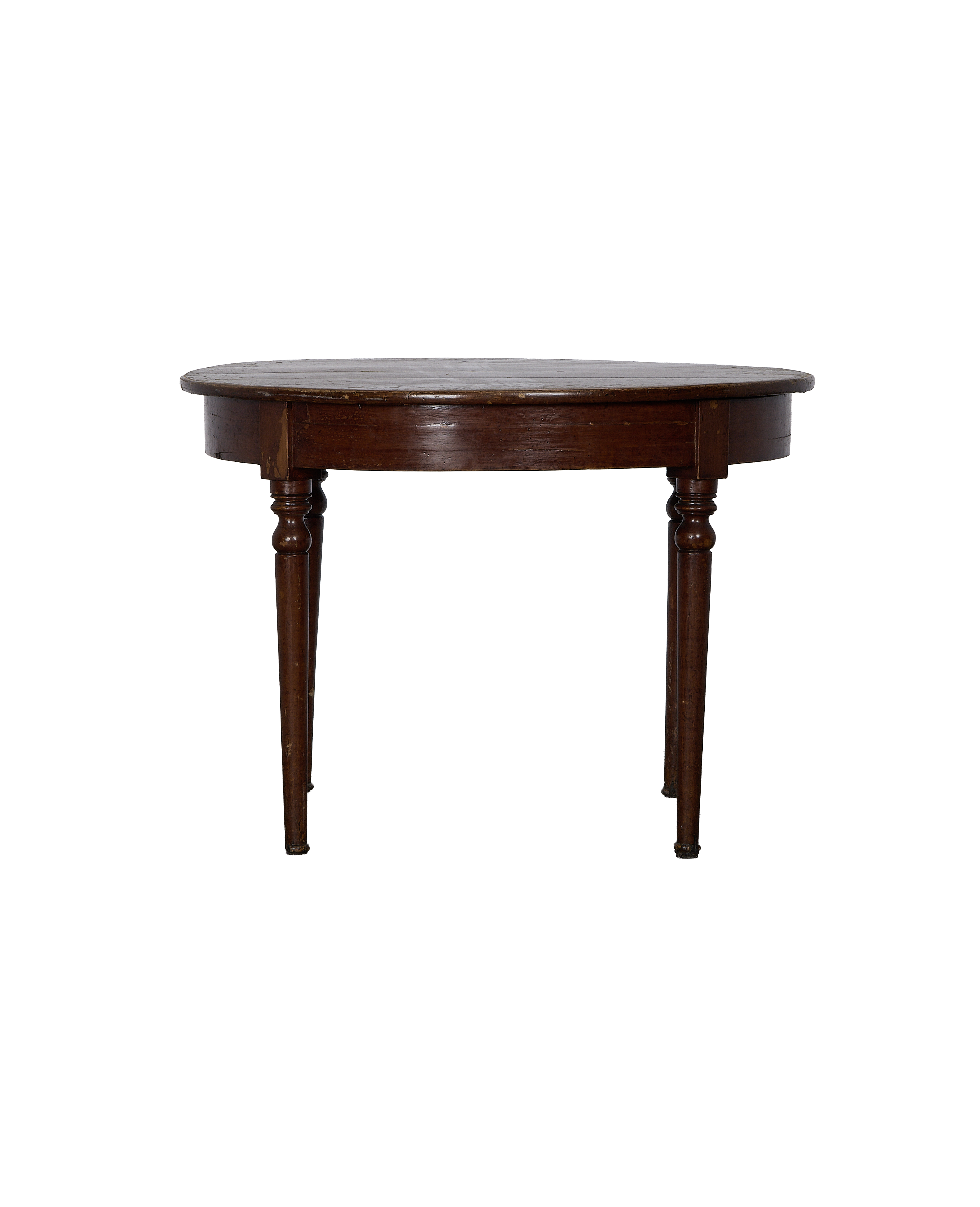 Vintage French oak round table, showing dark wood grain and turned legs from a side angle.