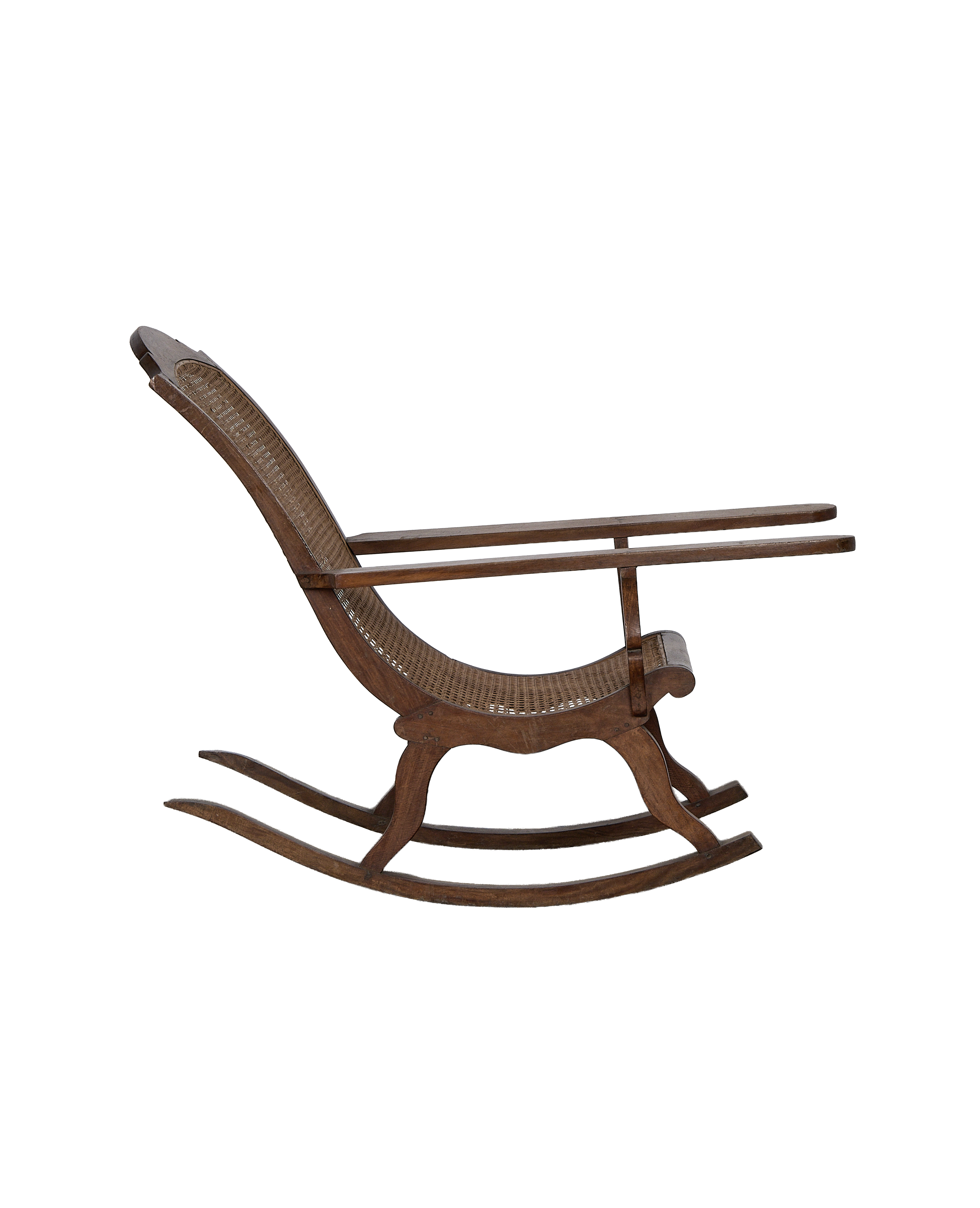 Vintage French oak lounge chair, rocking profile, showcasing beautiful cane weaving.
