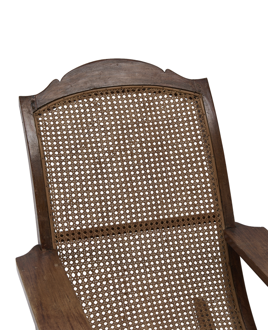 Vintage French oak wood lounge chair, showing intricate cane weaving detail of the backrest.