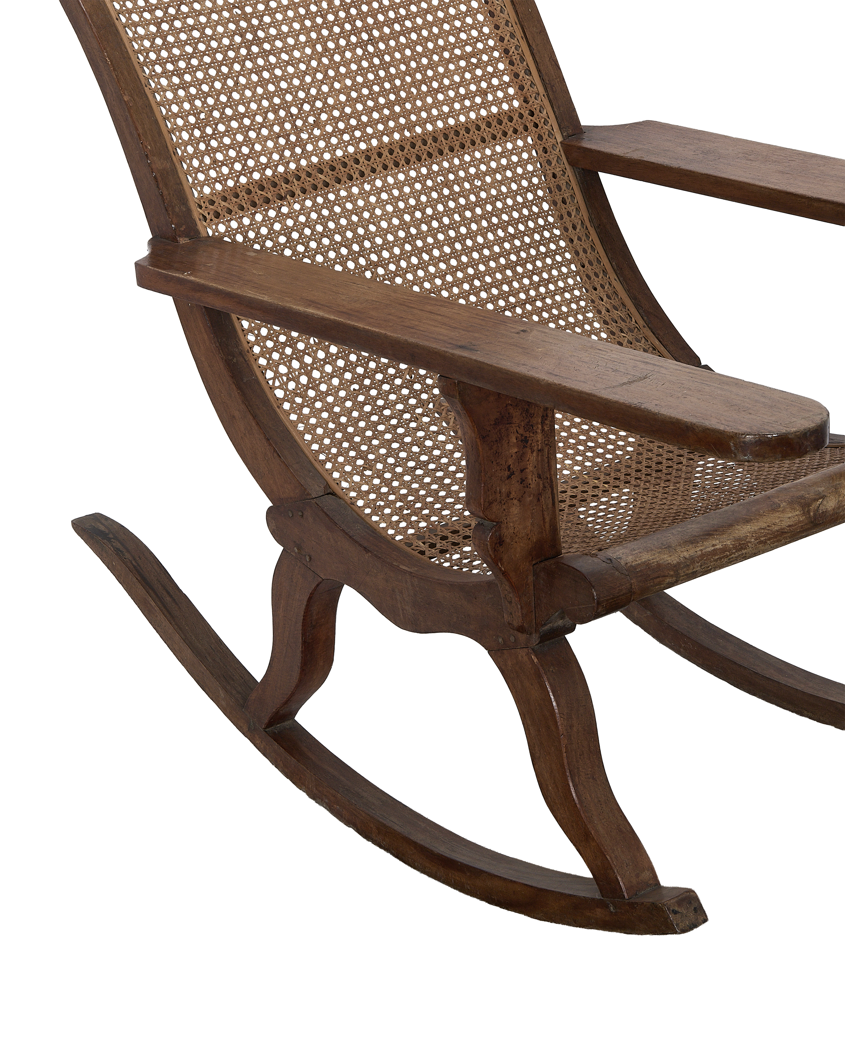 Vintage French oak lounge chair, cane weaving detail, and armrest from a side angle.