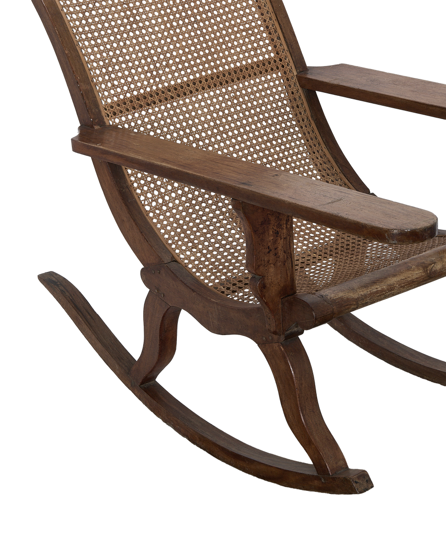 Vintage French oak lounge chair, cane weaving detail, and armrest from a side angle.